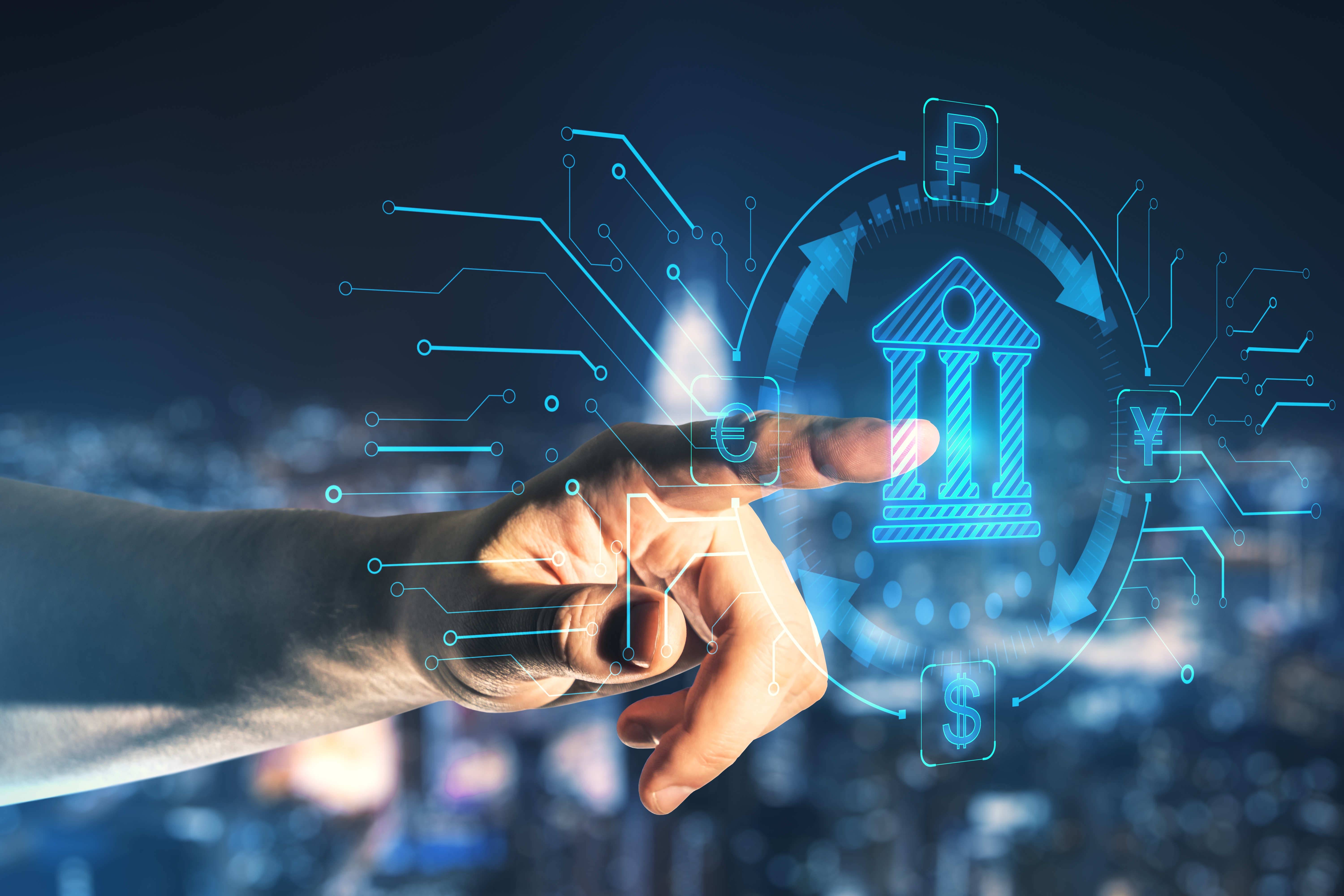 Hand pointing at a glowing blue hologram of a bank building, circled by exchange arrows linking euro, ruble, yen and dollar symbols, with circuit lines branching out against a blurred city skyline at night.