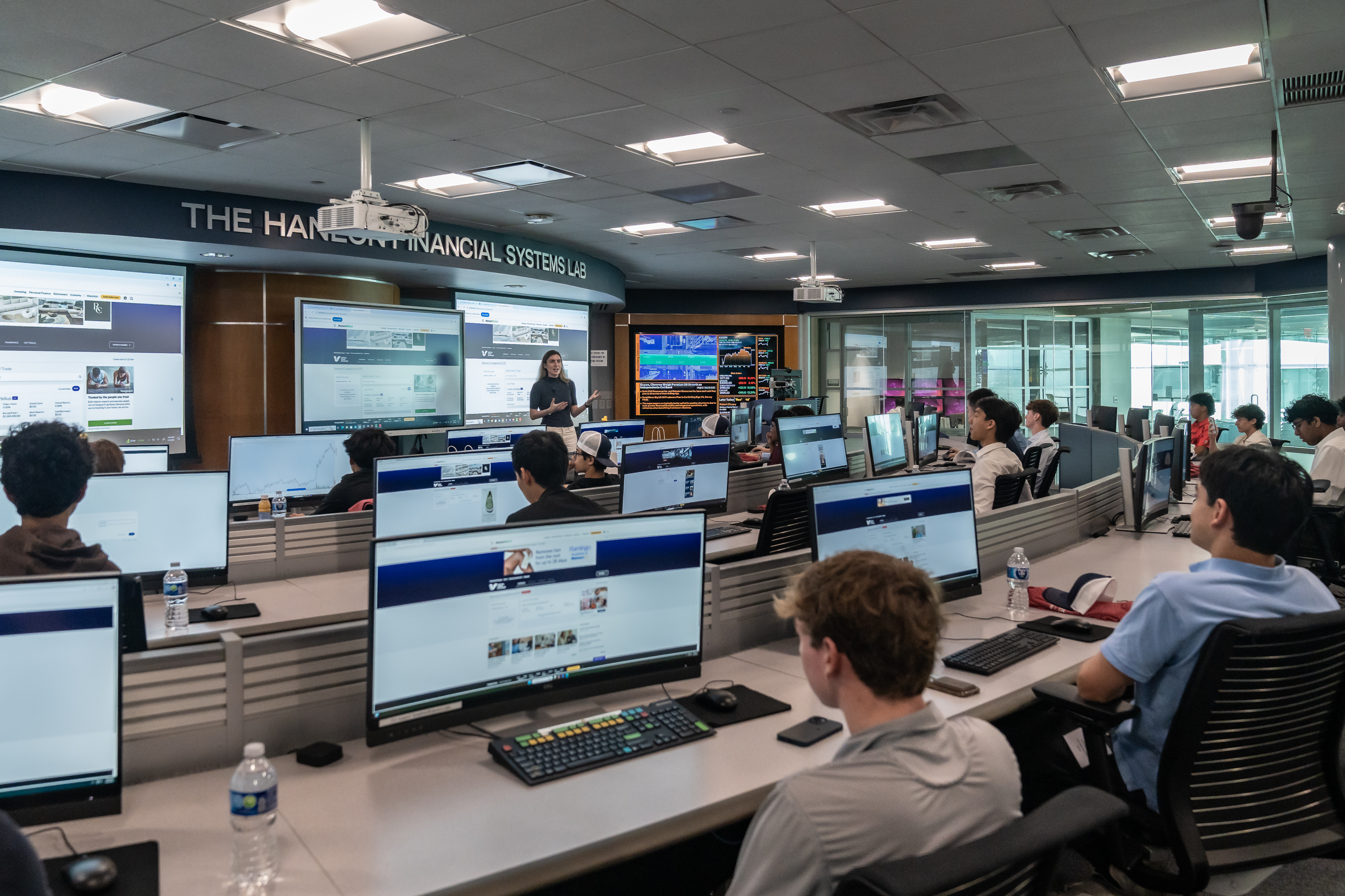 Students sit behind computer monitors in the Hanlon Financial Systems Lab.