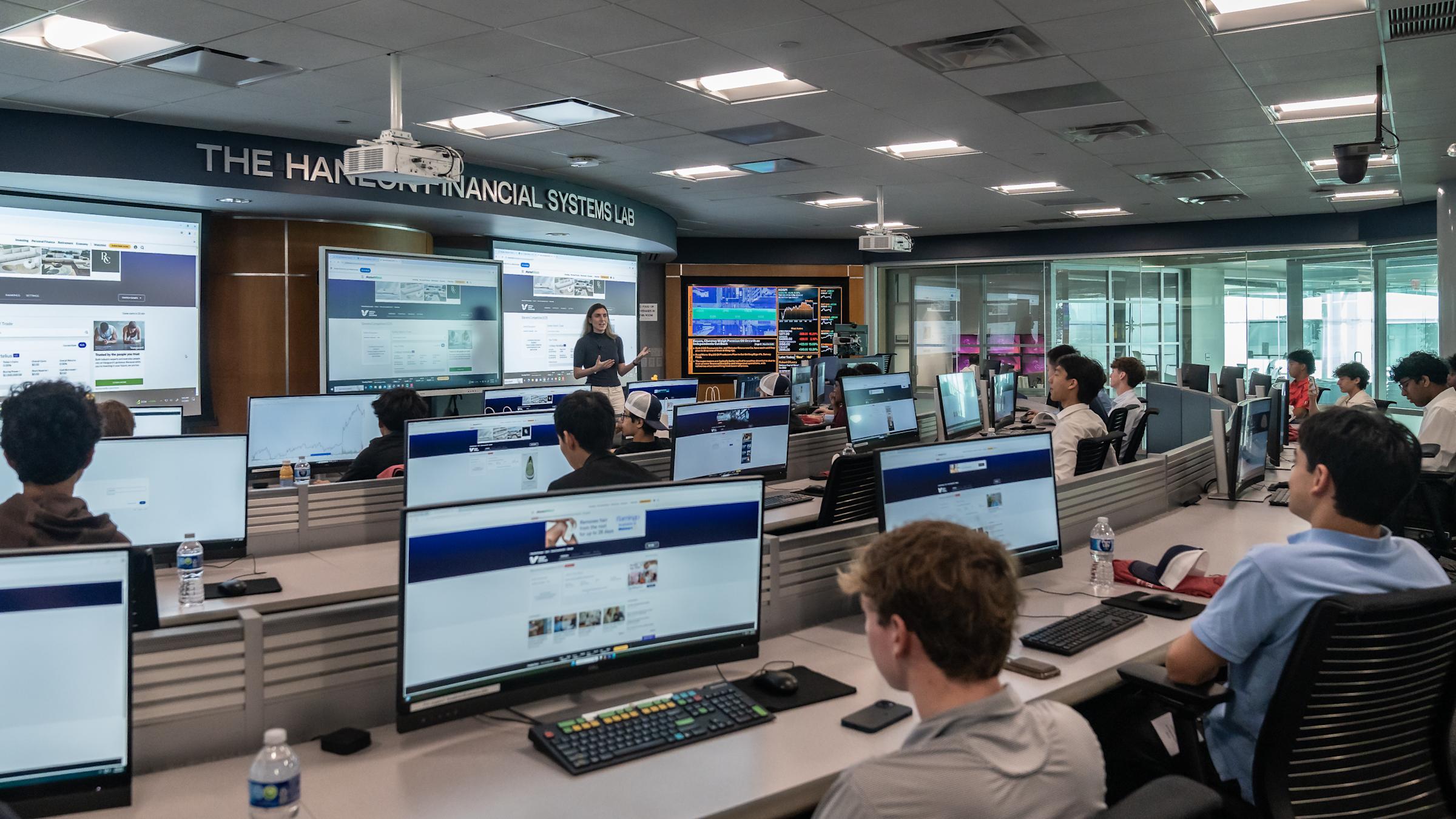 Students sit behind computer monitors in the Hanlon Financial Systems Lab.