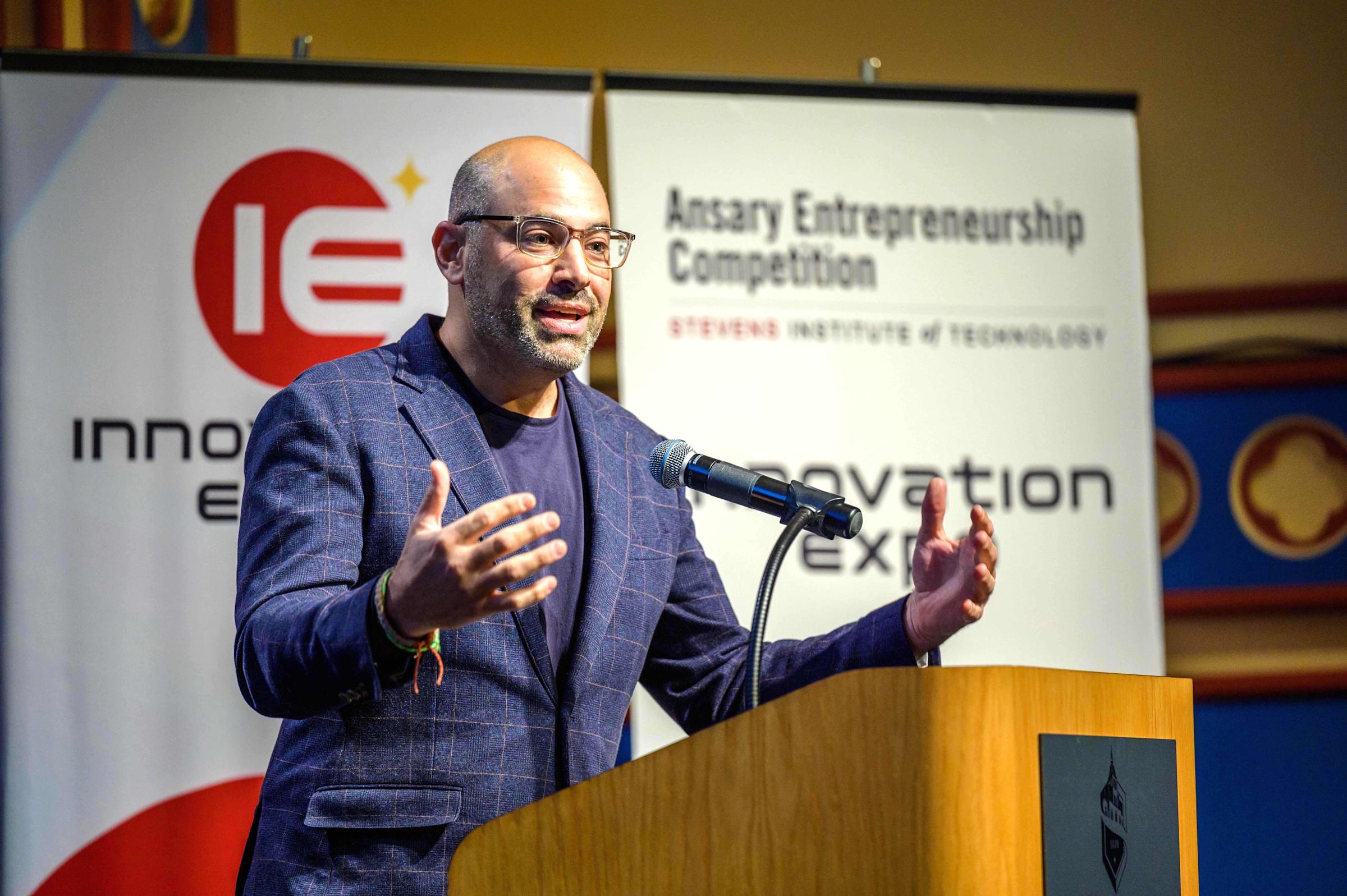 2023 Ansary competition host Aaron Price on stage at the Stevens Innovation Expo