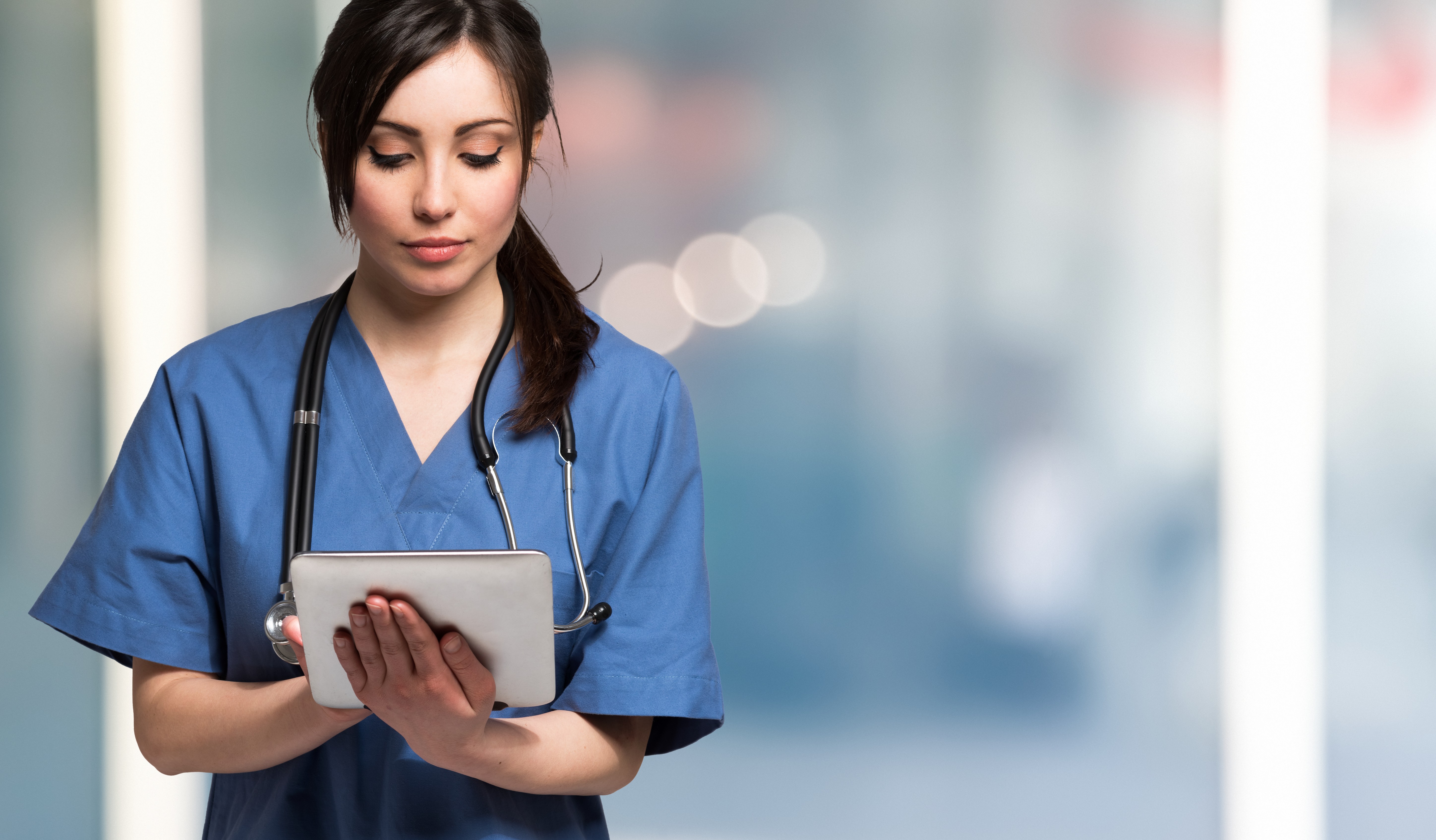female doctor holding a tablet