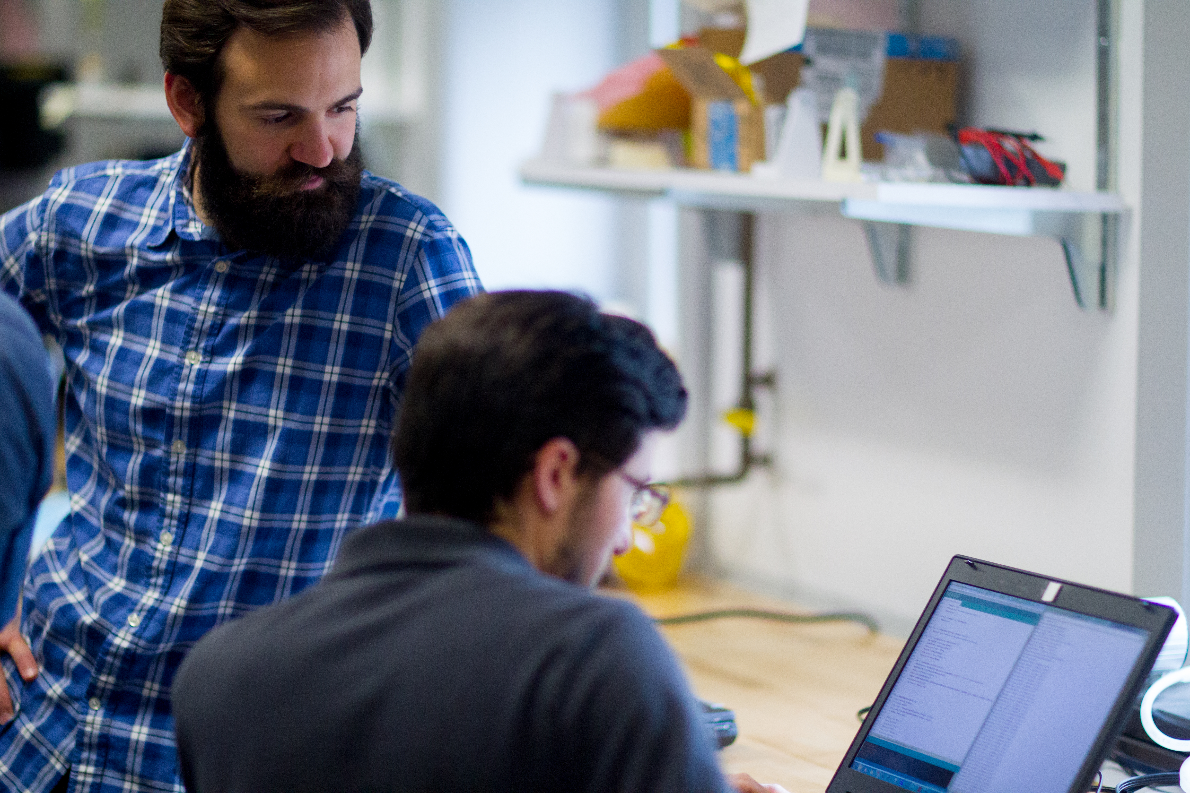 two students viewing a laptop