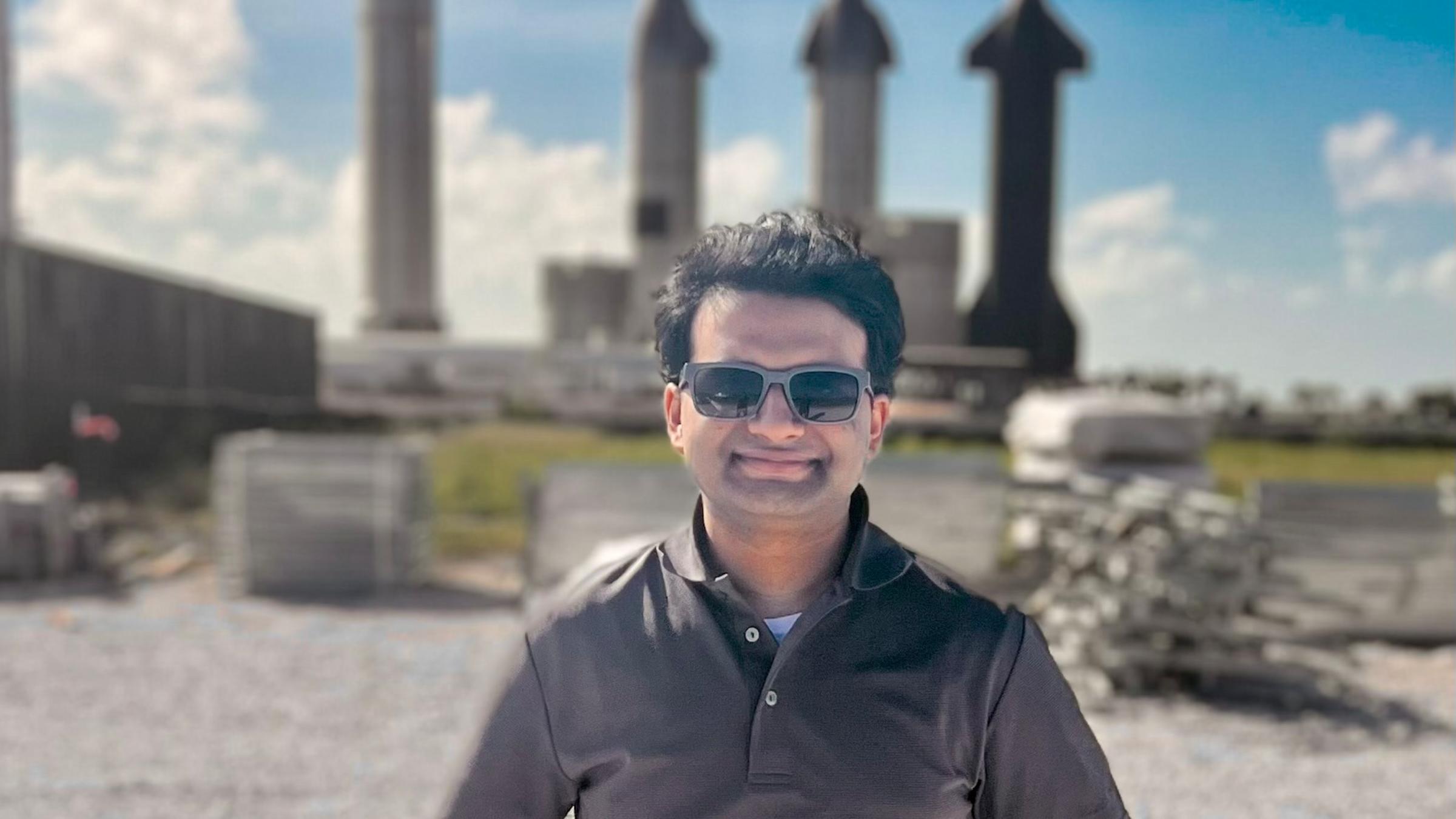 Arjun Krishna poses in front of rockets