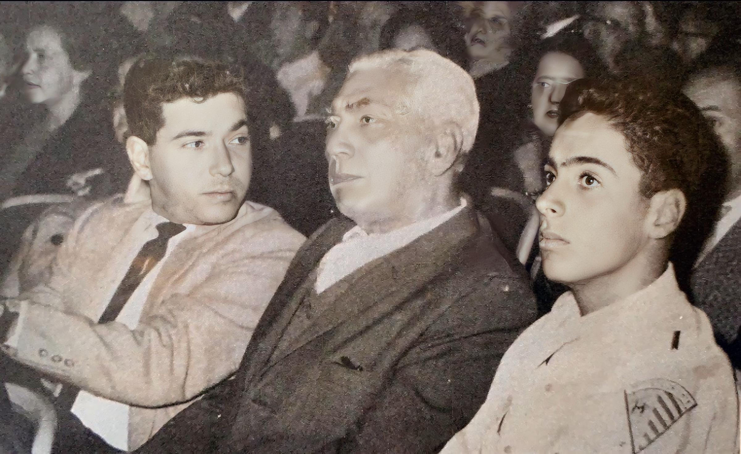 Three people sitting at a high school graduation.
