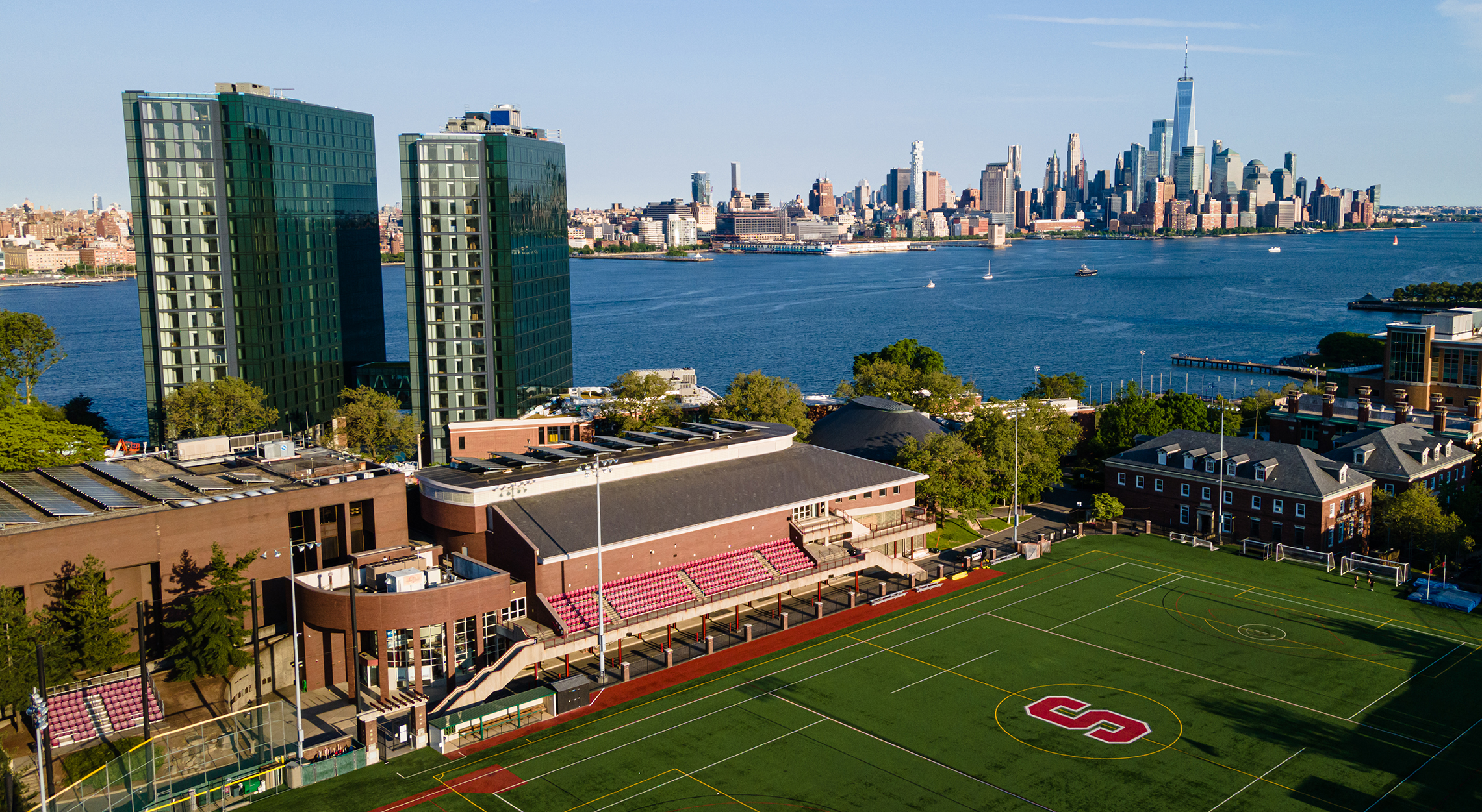 aerial view of campus with Manhattan skyline