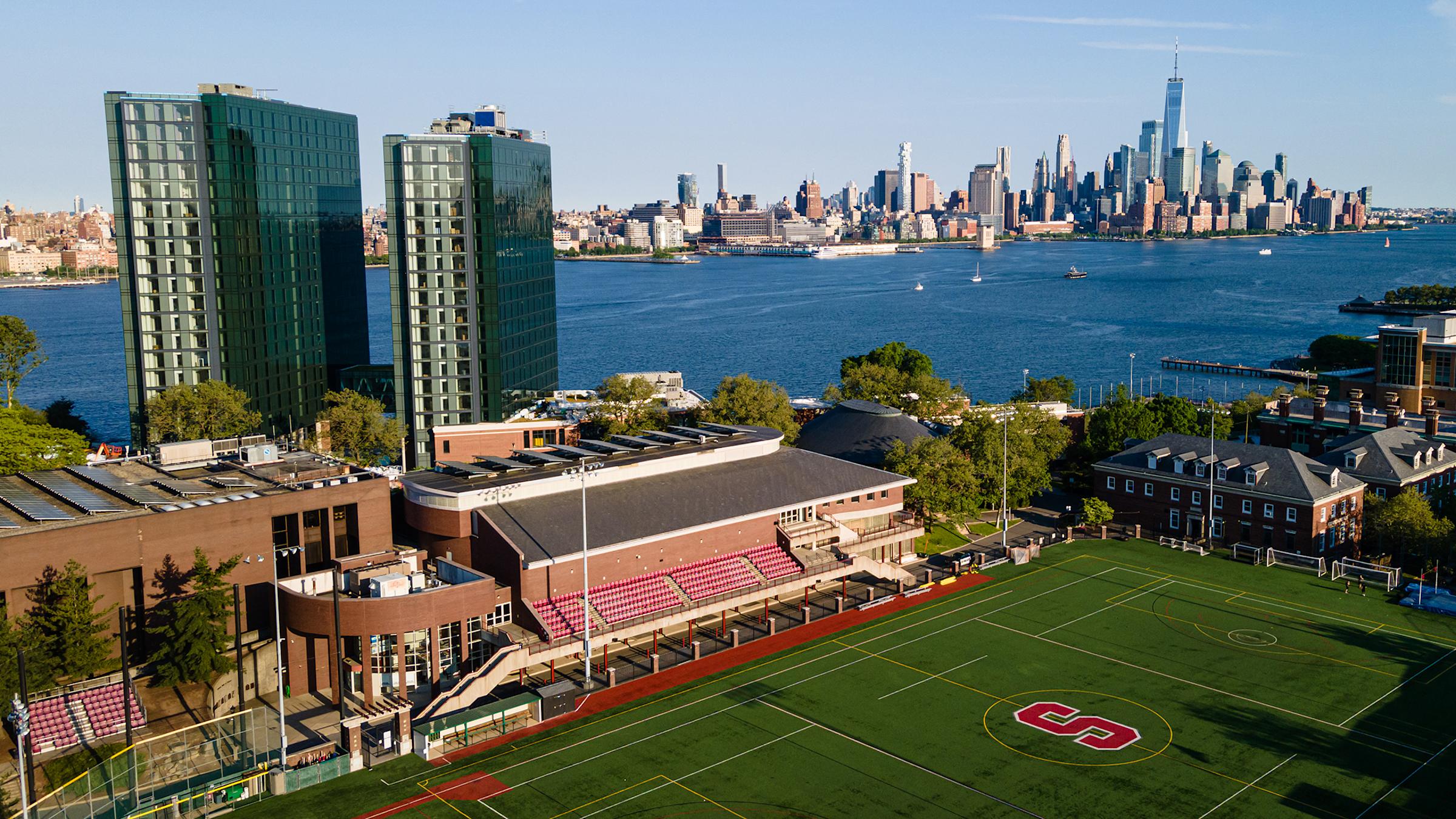 aerial view of campus with Manhattan skyline