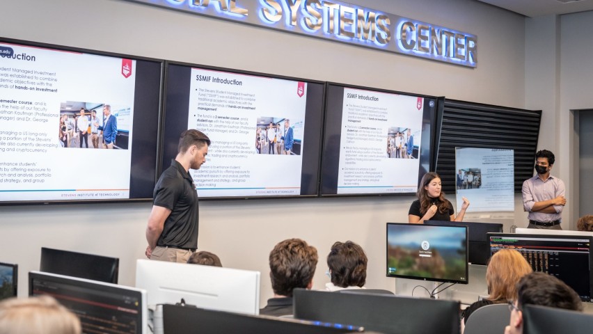 The SMIF's senior management team (from left), Justin Doyle '23, Doris Vazacopolous '23 and Matthew Thomas '24 present to visiting MDC students.