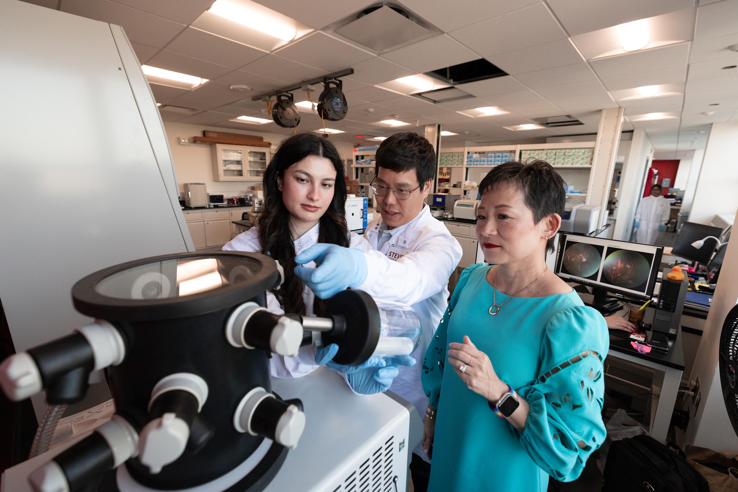 Bridging engineering and medicine: students team up with BME Chair Jennifer Kang-Mieler at the lyophilizer.