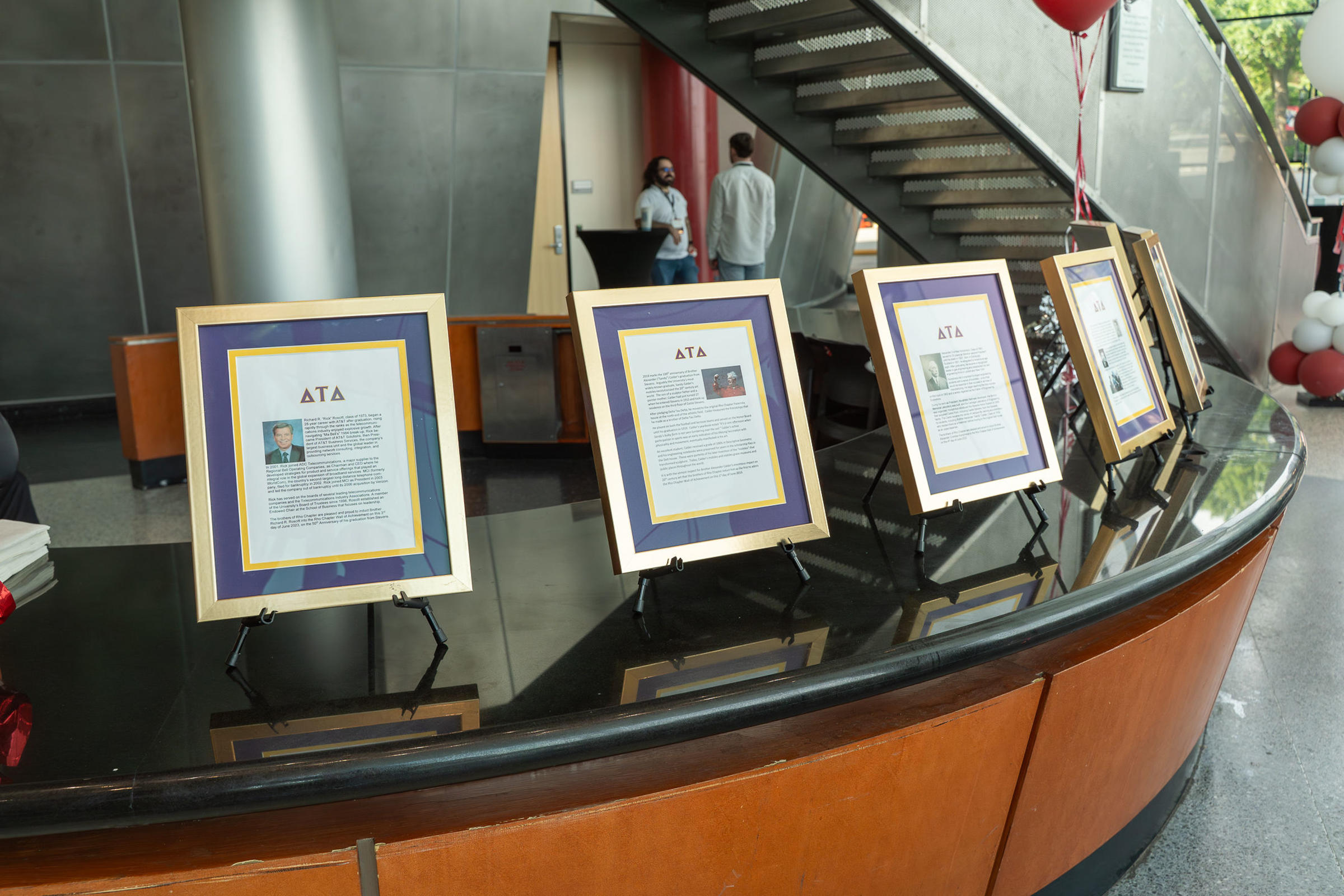 Several framed citations honoring Delta Tau Delta fraternity's Rho Delt Wall of Achievement