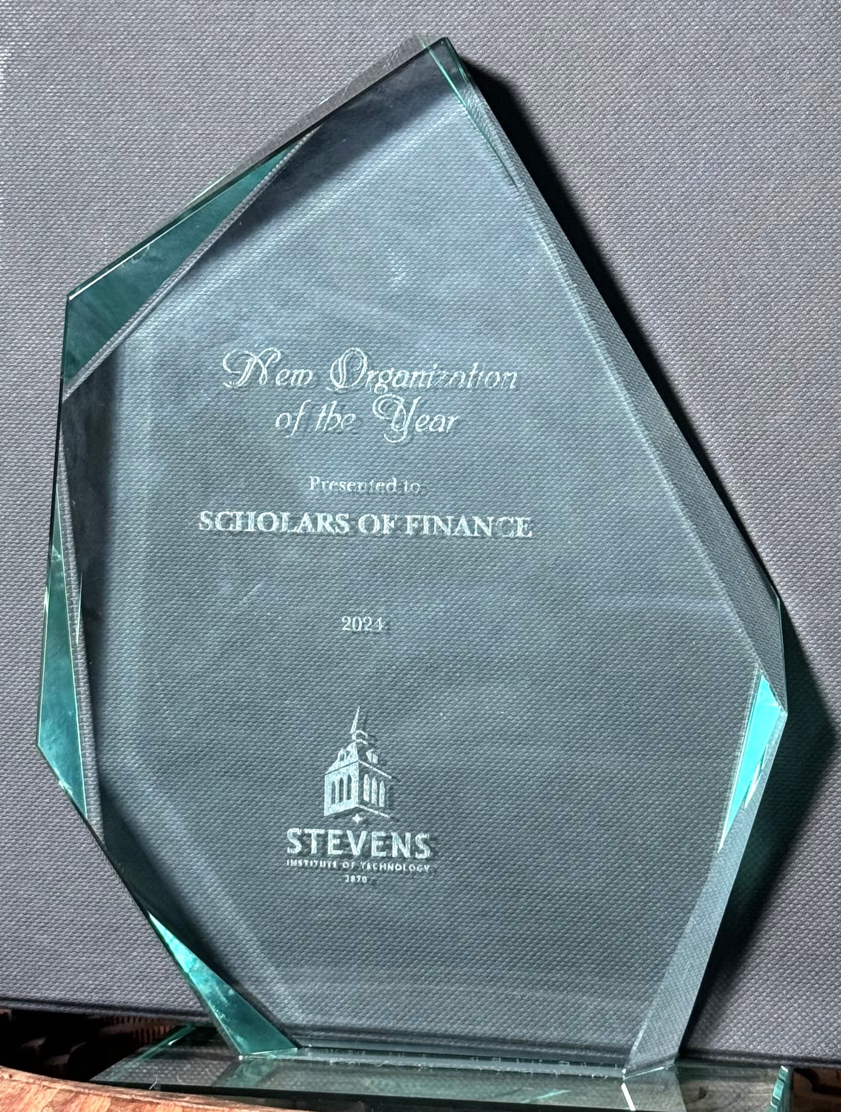 A crystal trophy commemorating the New Chapter of the Year Award.