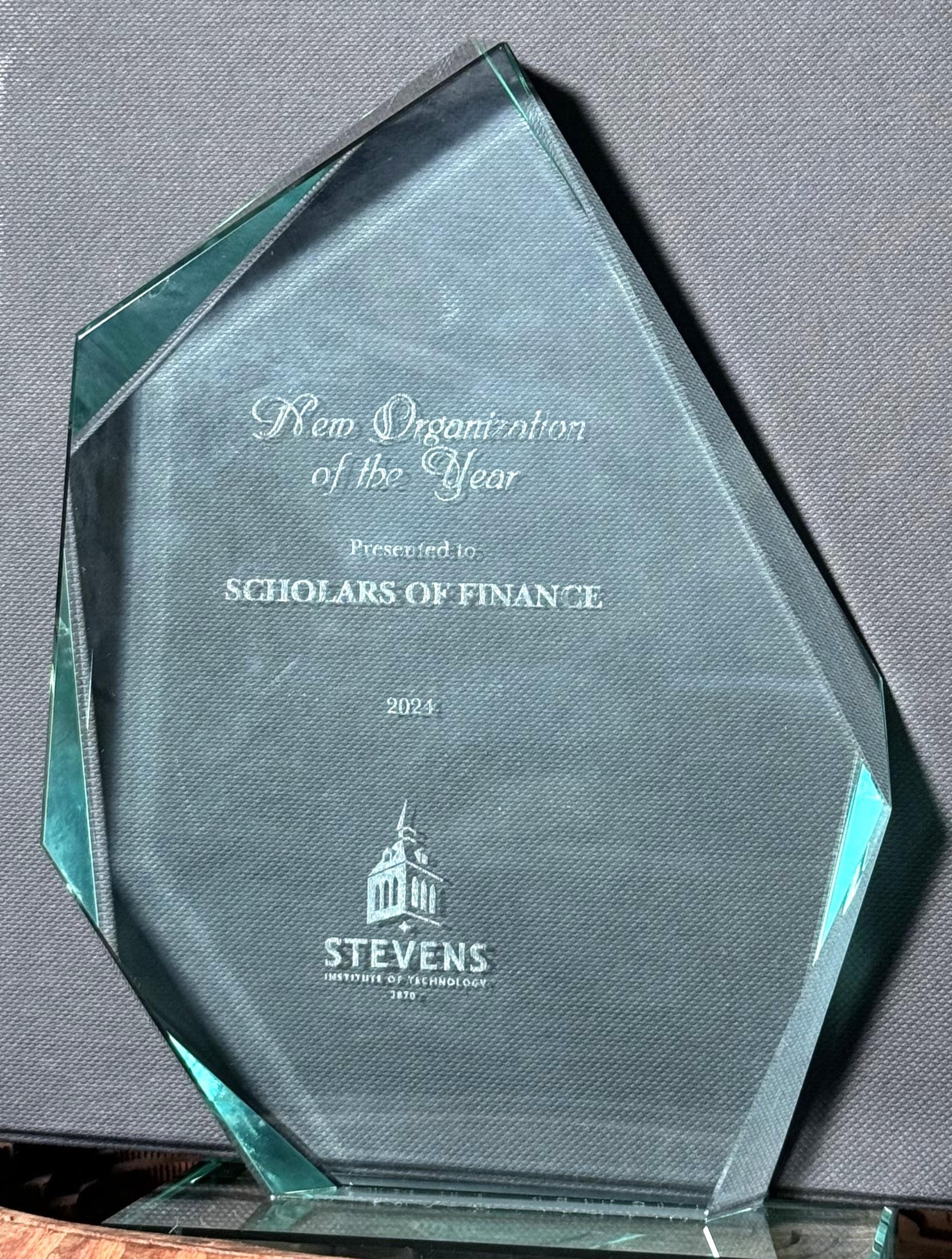 A crystal trophy commemorating the New Chapter of the Year Award.