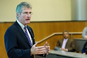 Sean Hanlon speaking to a room of people