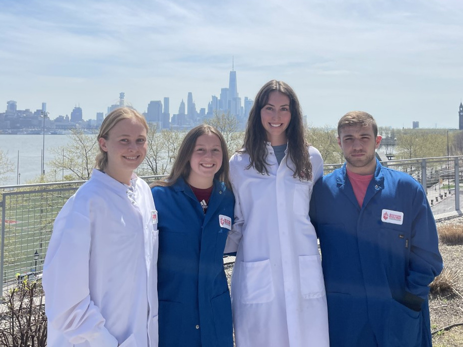 The Black Mass Separation Team 2023 stand outside in front of the New York City skyline