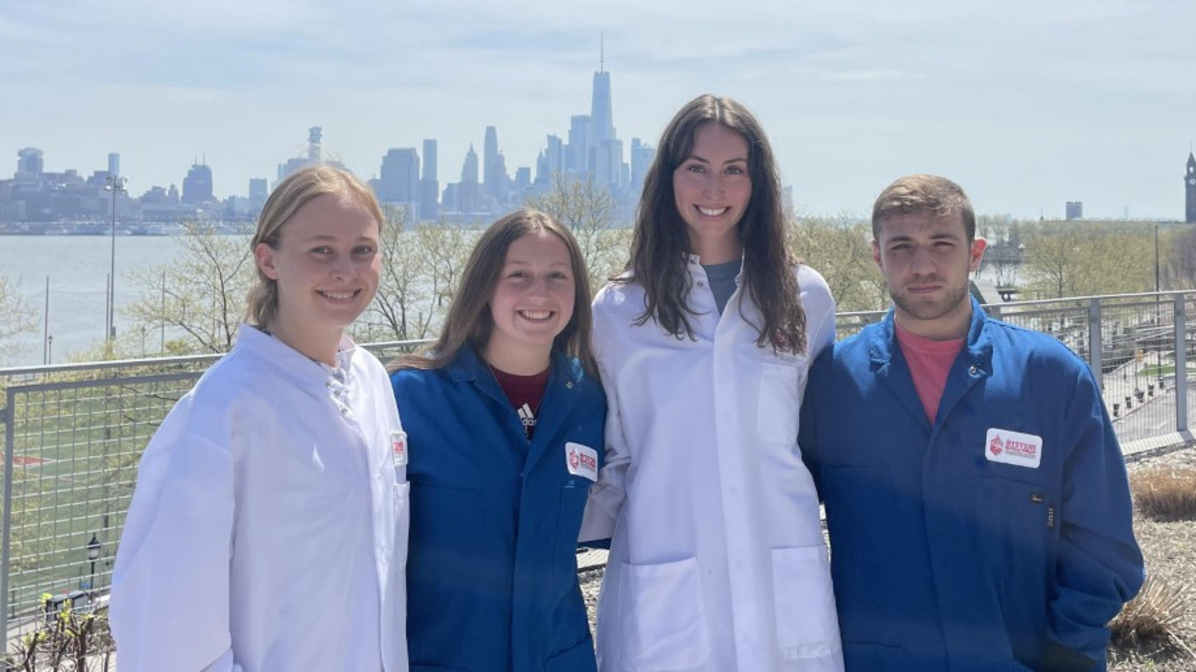 The Black Mass Separation Team 2023 stand outside in front of the New York City skyline