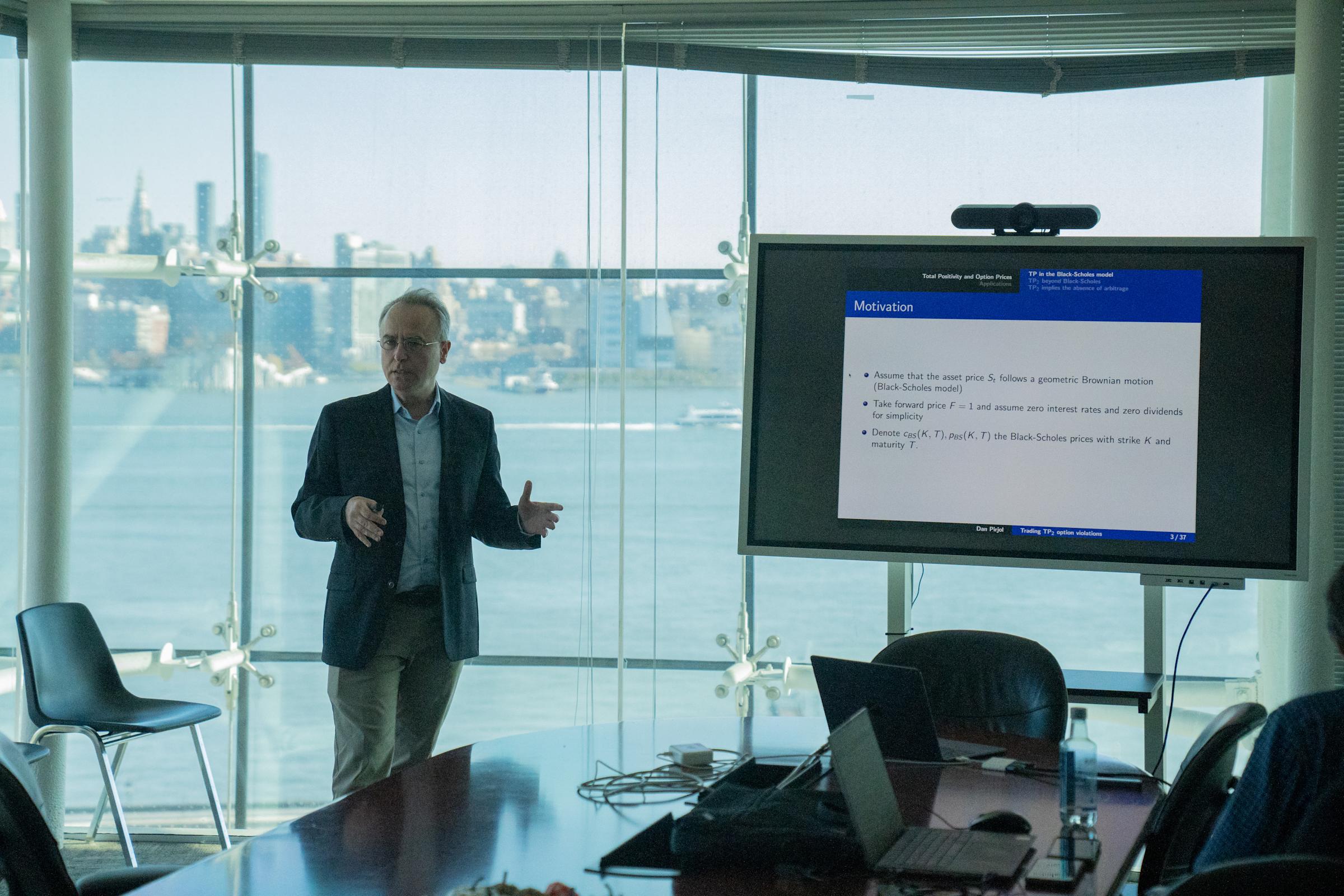 Dan Pirjol presents his research