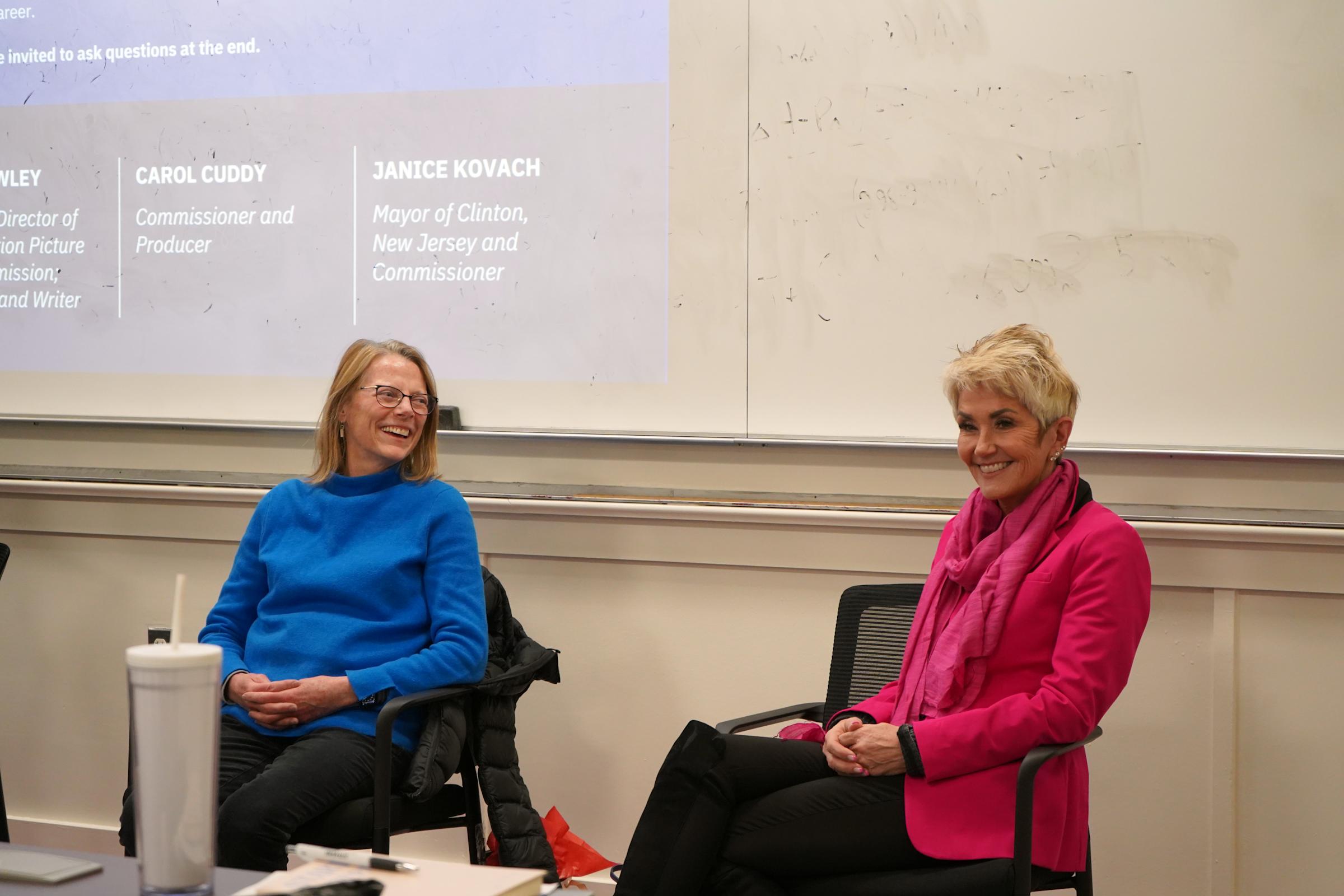 Carol Cuddy and Janice Kovach talking to students.