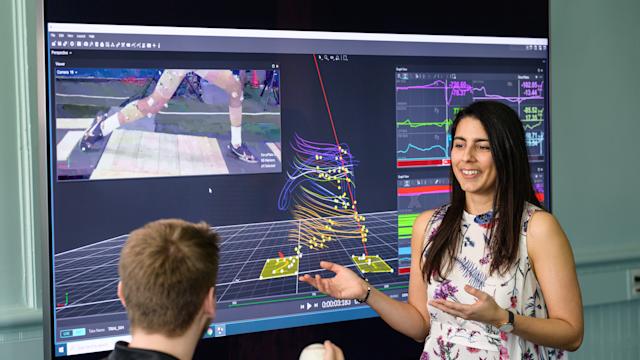 Professor gives presentation in front of screen