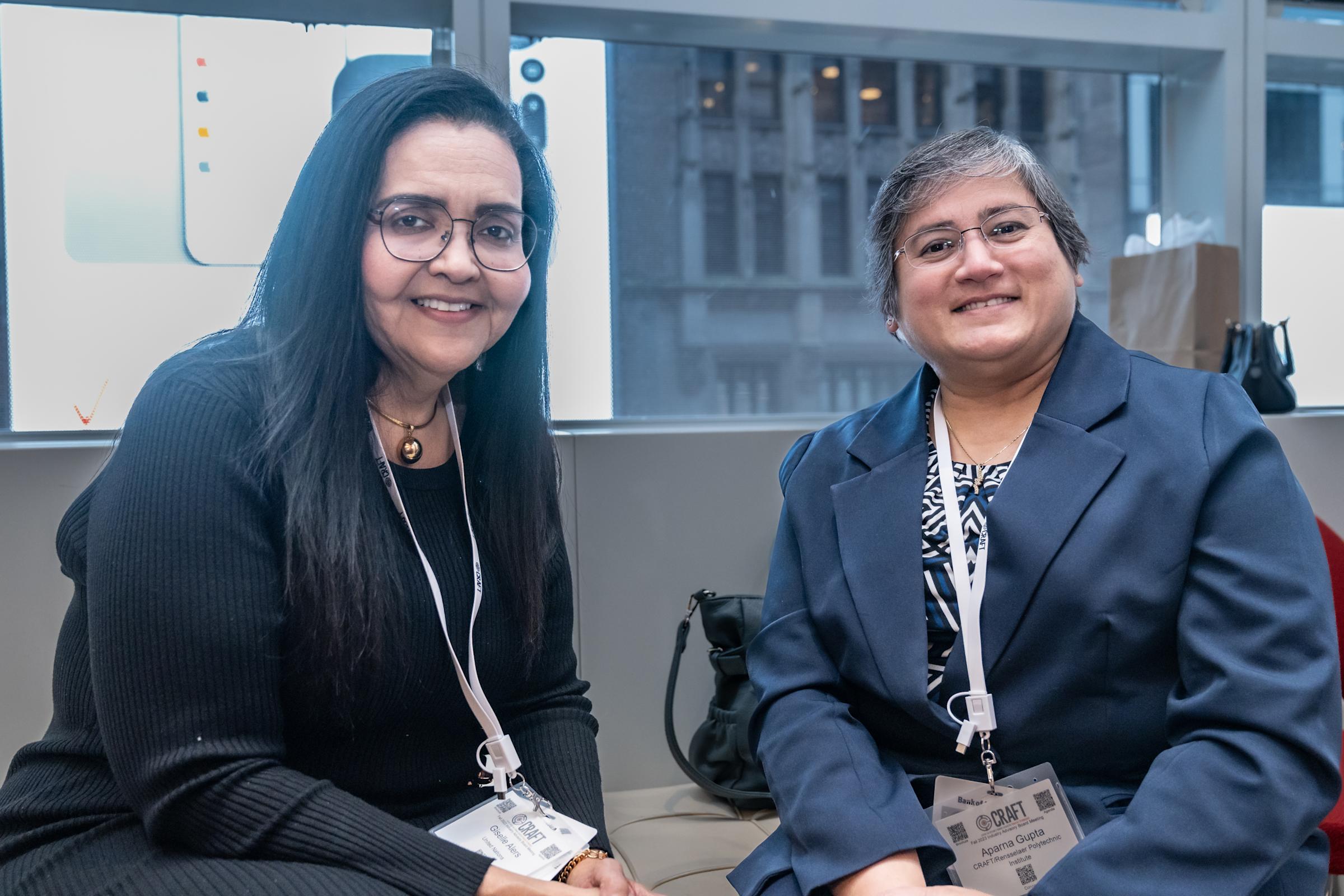 Two people pose for a photo at the CRAFT Advisory Board Meeting reception.