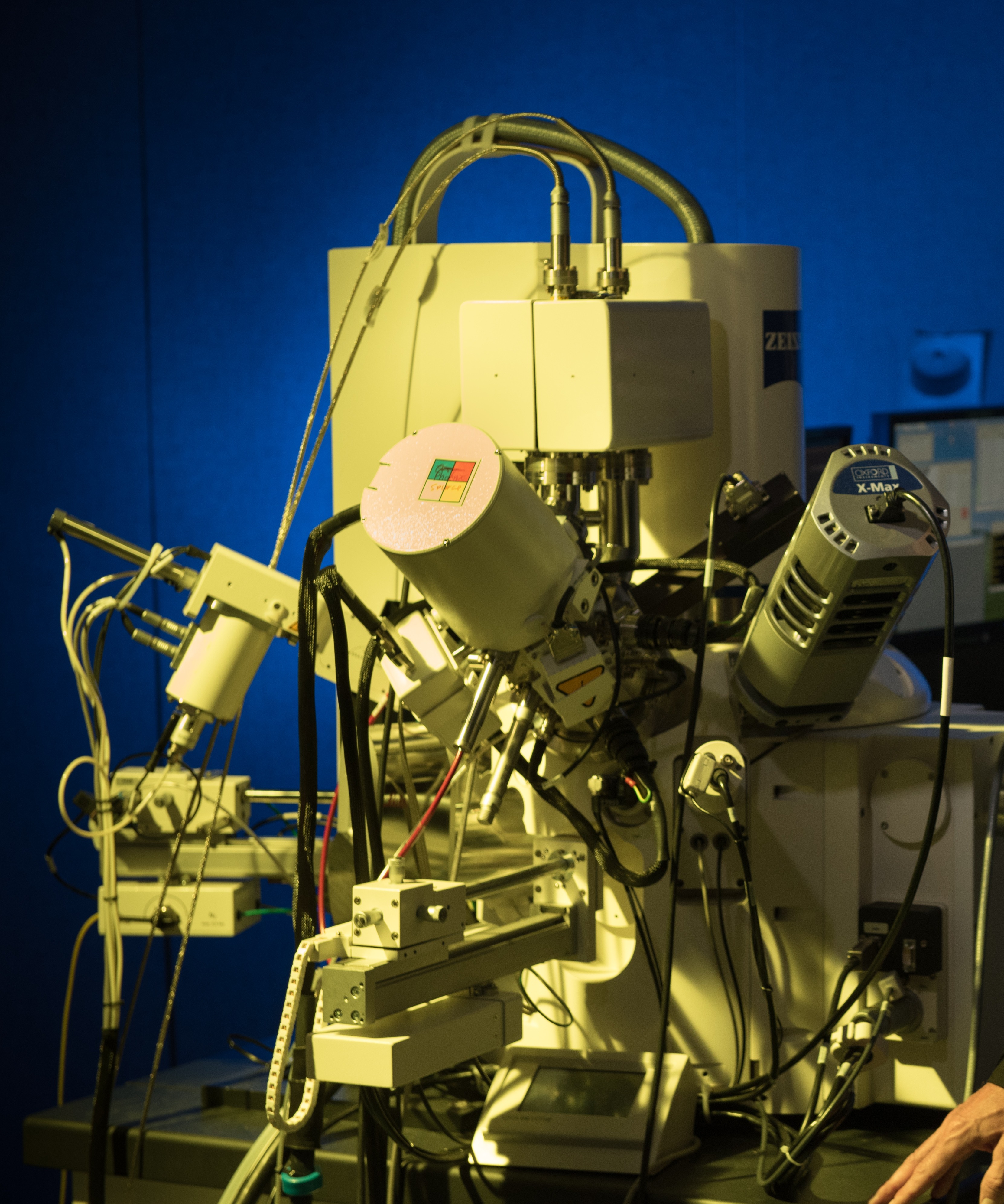 Matt Libera stands alongside imaging equipment in the Laboratory for Multiscale Imaging.