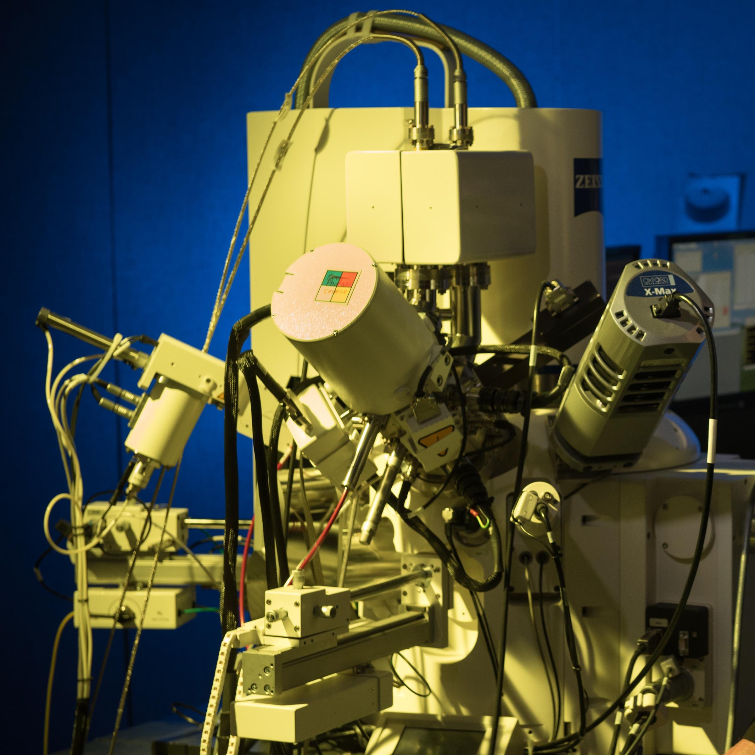 Matt Libera stands alongside imaging equipment in the Laboratory for Multiscale Imaging.