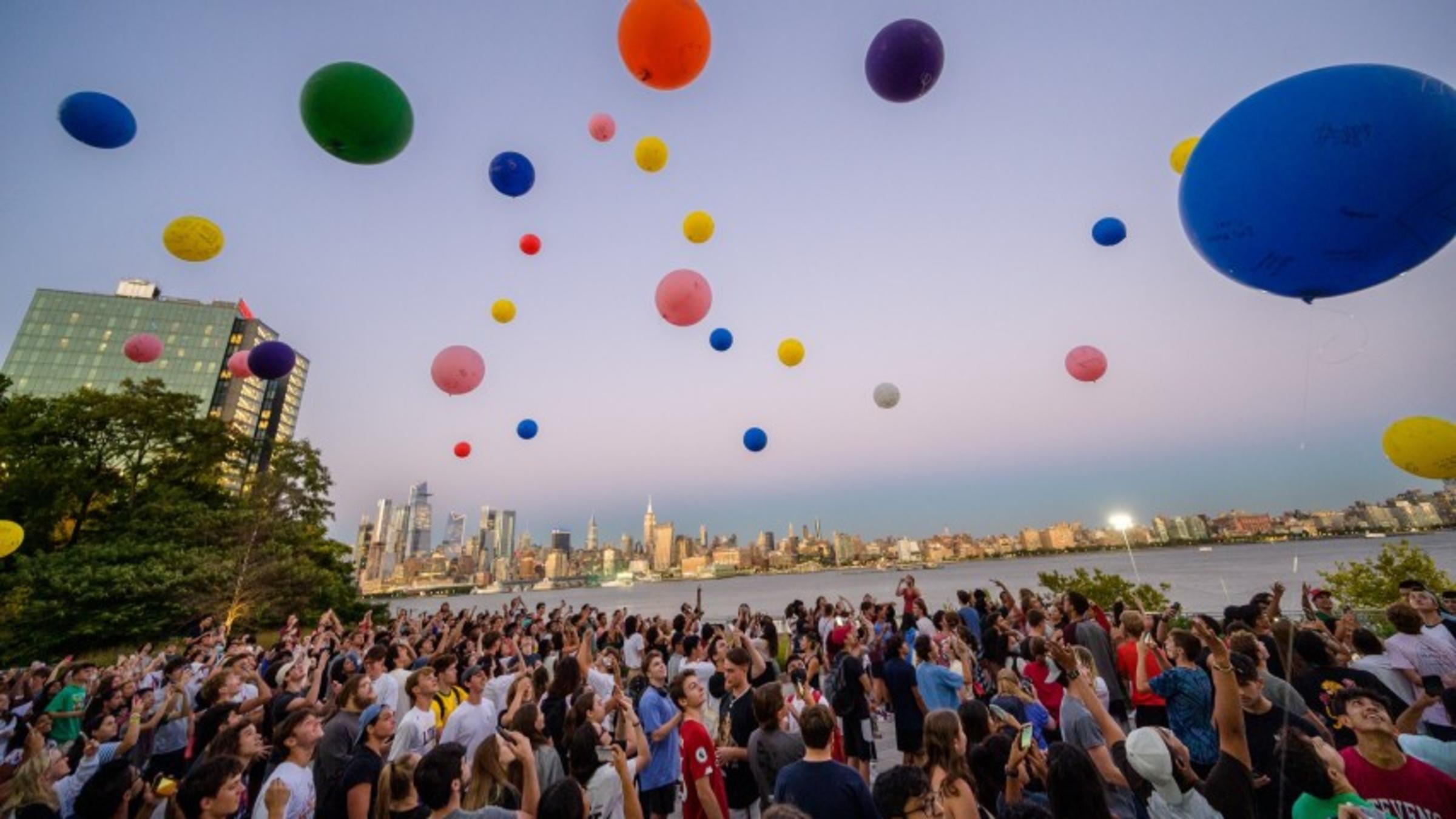 Students releasing balloons into the sky