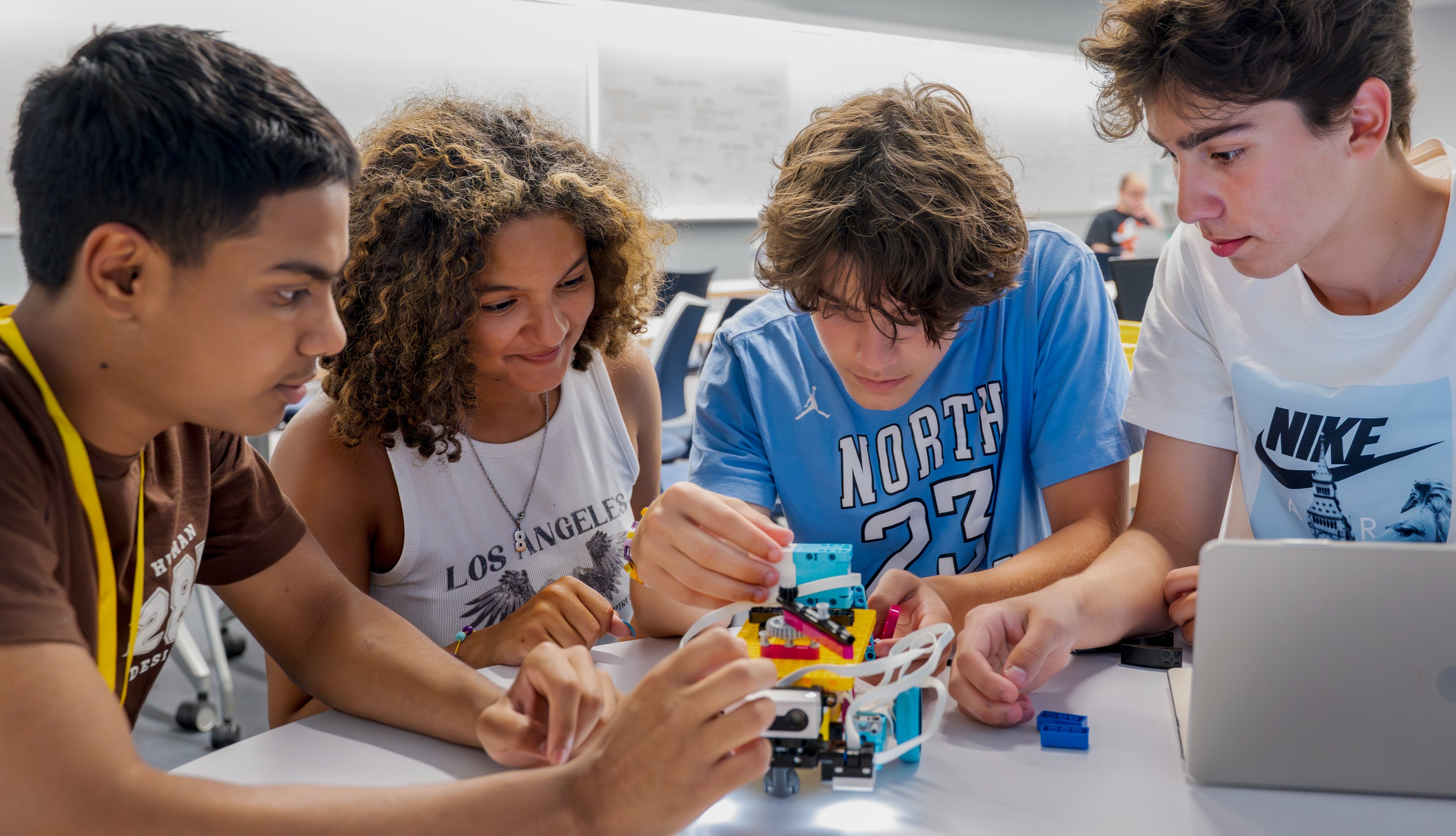 Group of 3 students working on an activity at a desk