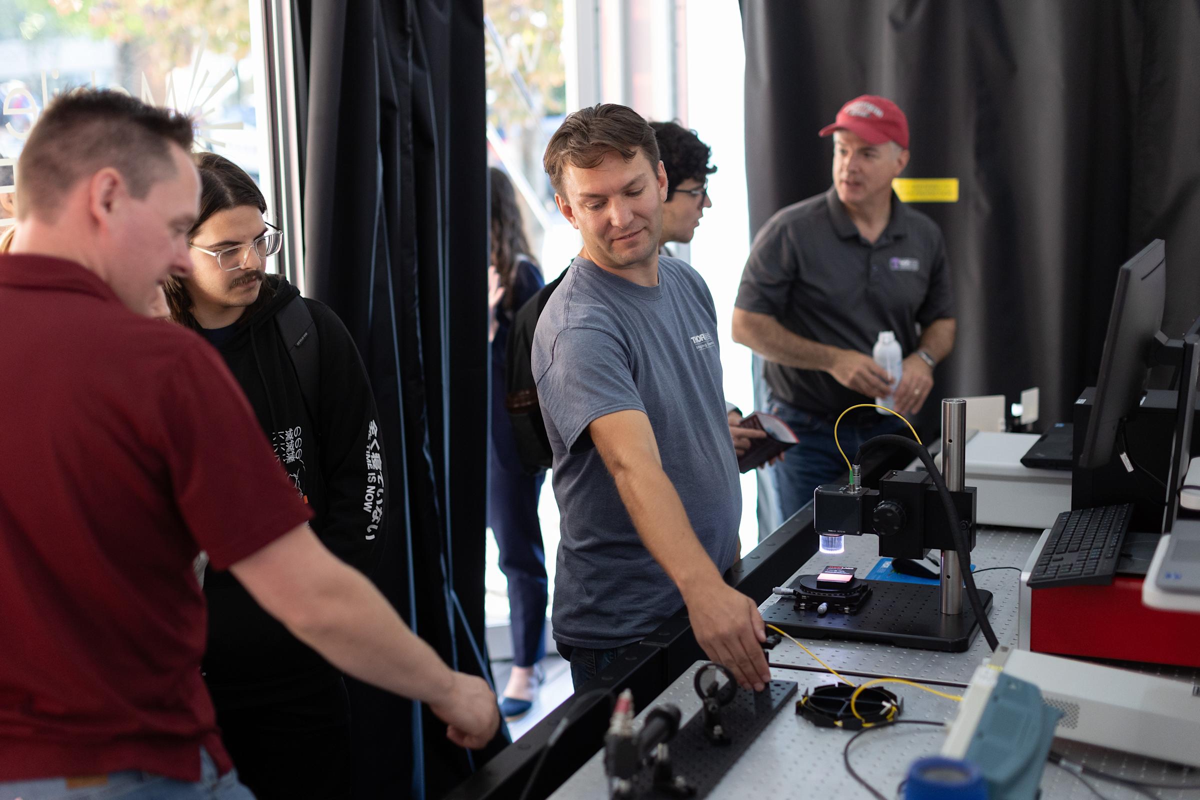 Bill Warger ’03 and Chris Pinyan ’89 leading photonics demonstrations for Stevens students