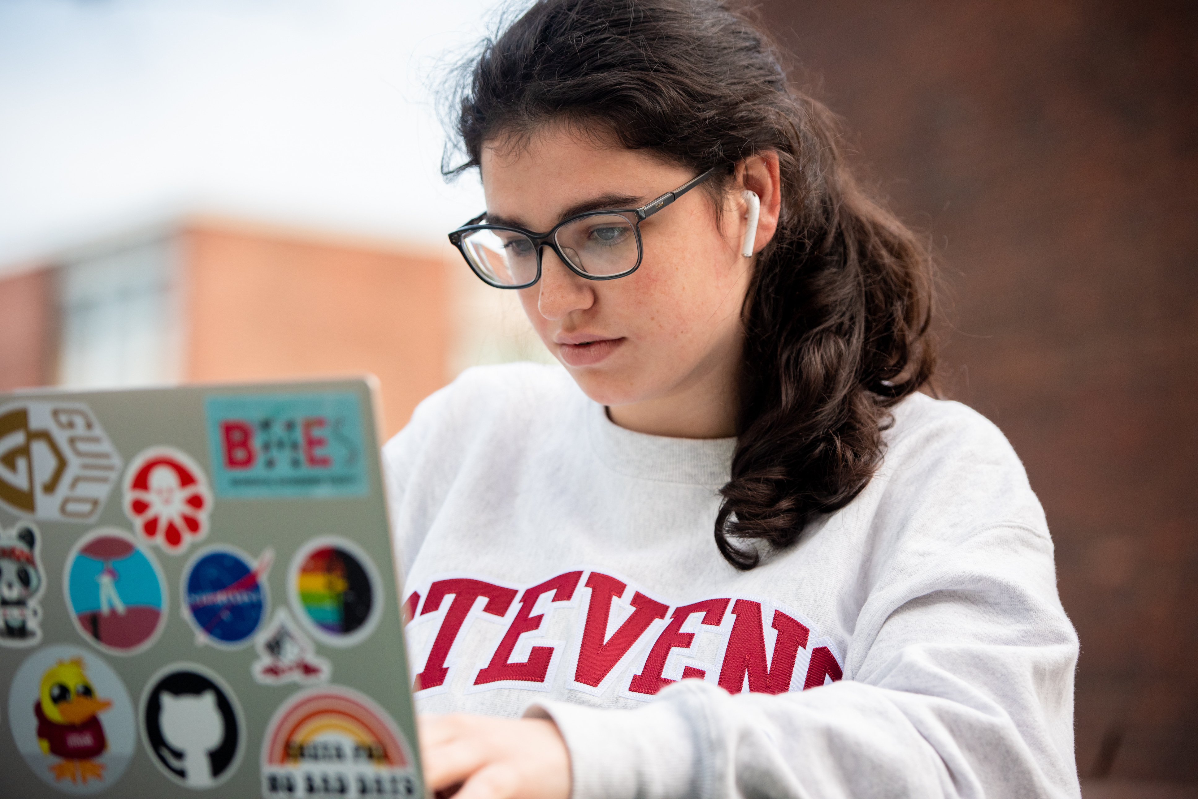 Student and viewing laptop