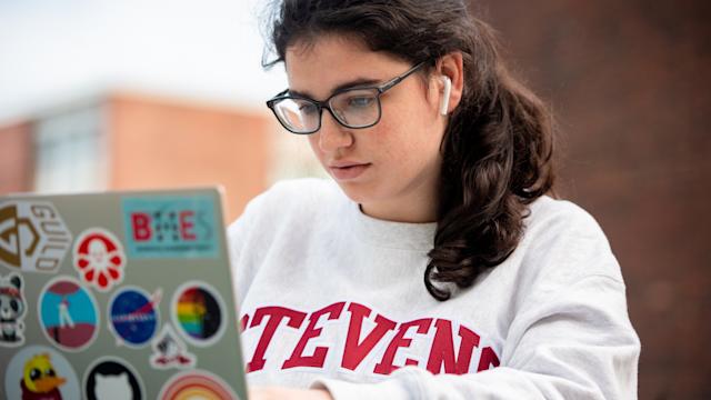 Student and viewing laptop