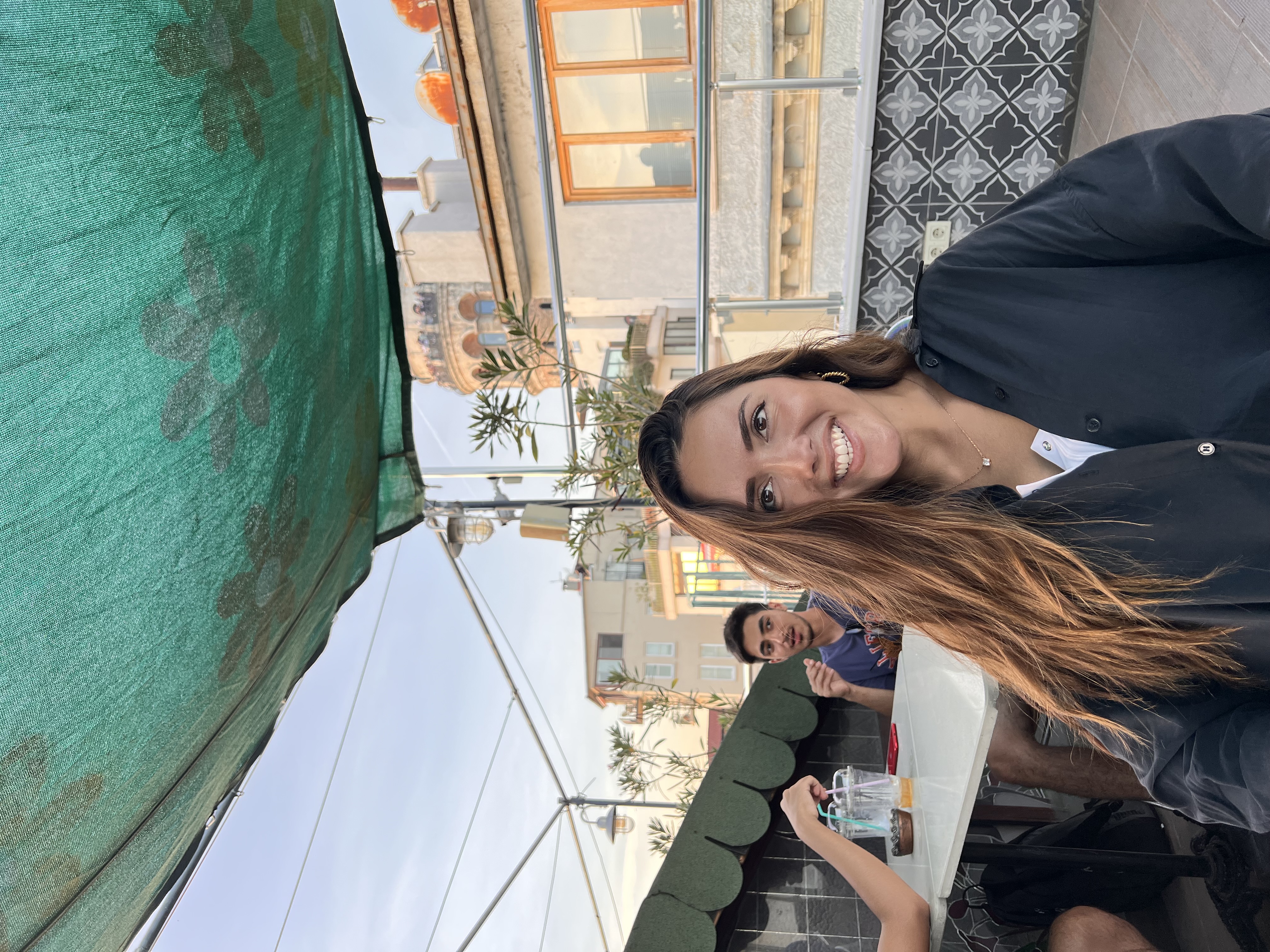 Daniela Cardona smiles at camera outside