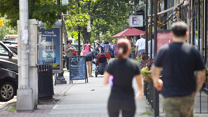 Pedestrians walk along the businesses of Washington Street, in Hoboken.