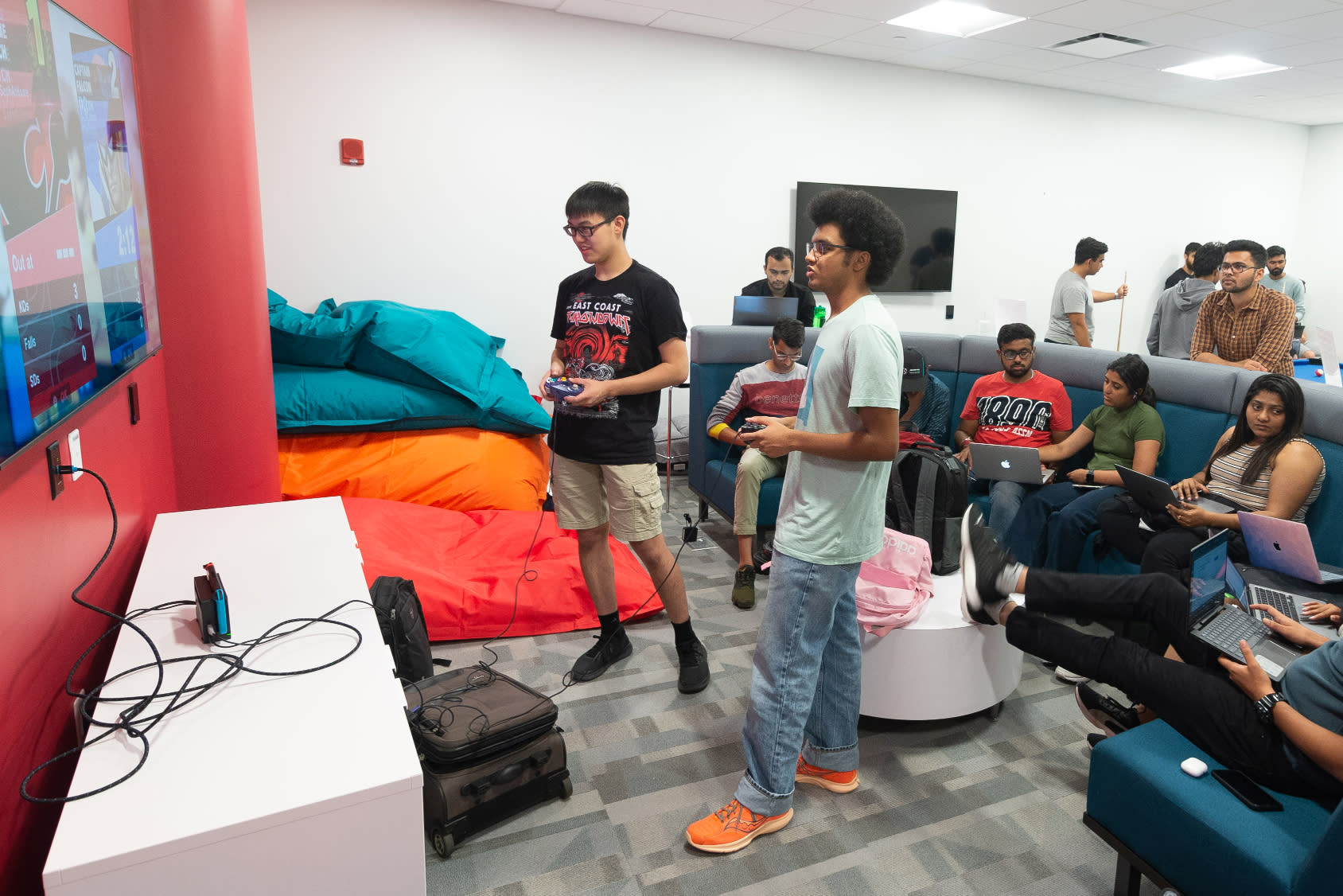 Gamers gaming in game room.