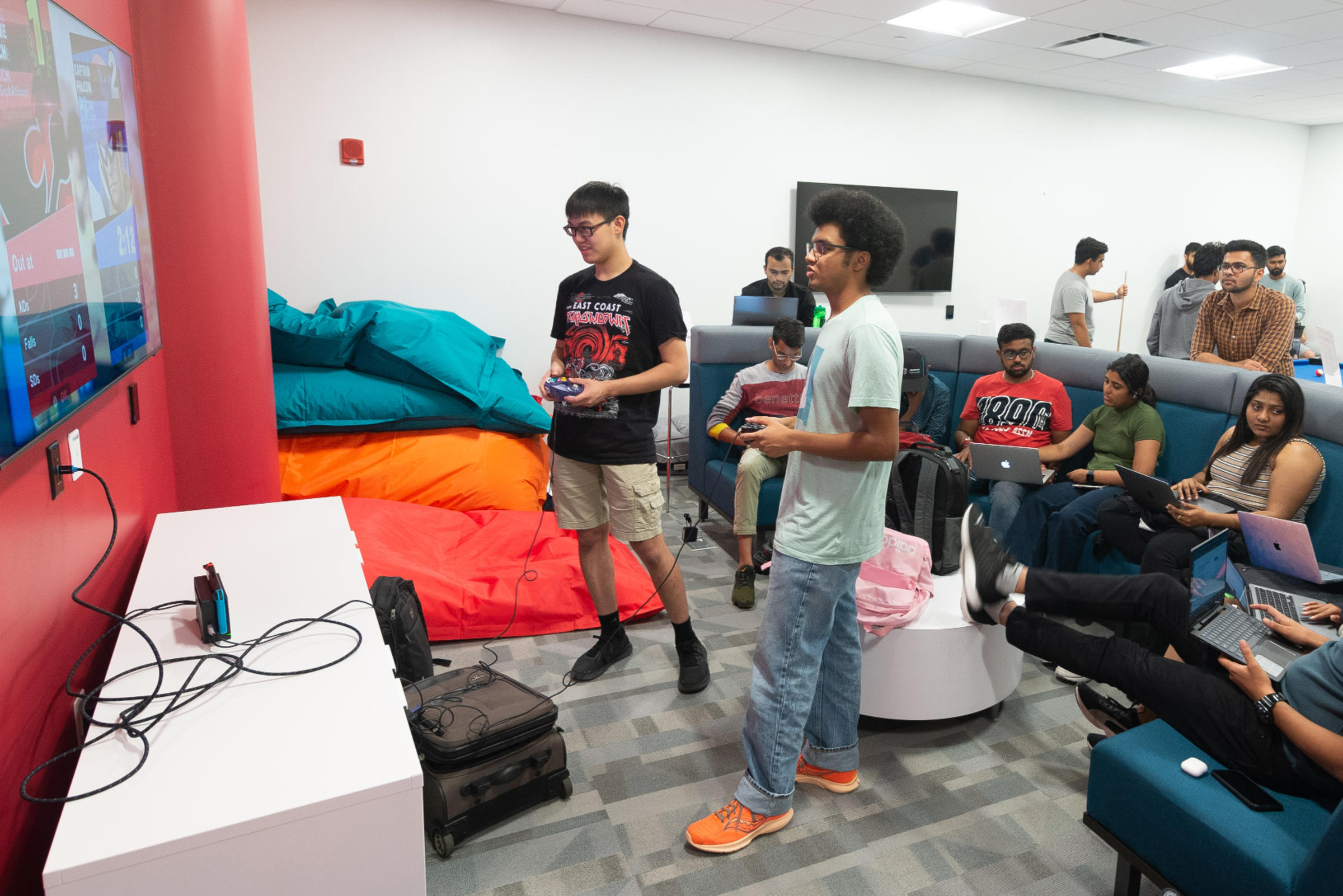 Gamers gaming in game room.