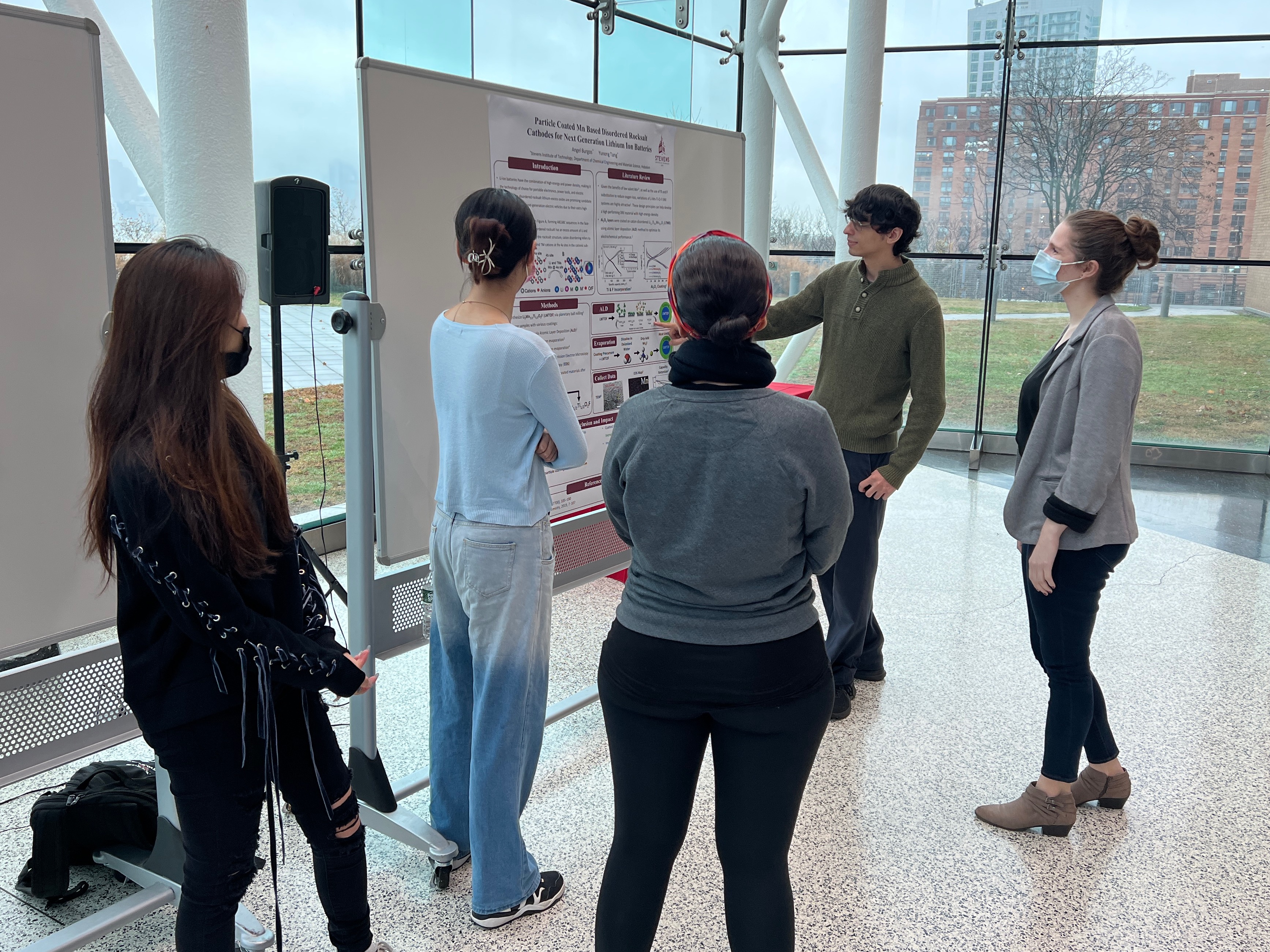 Sarah Goodman with students at poster session 