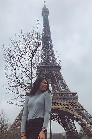 Sheila outside the Eiffel Tower in Paris.