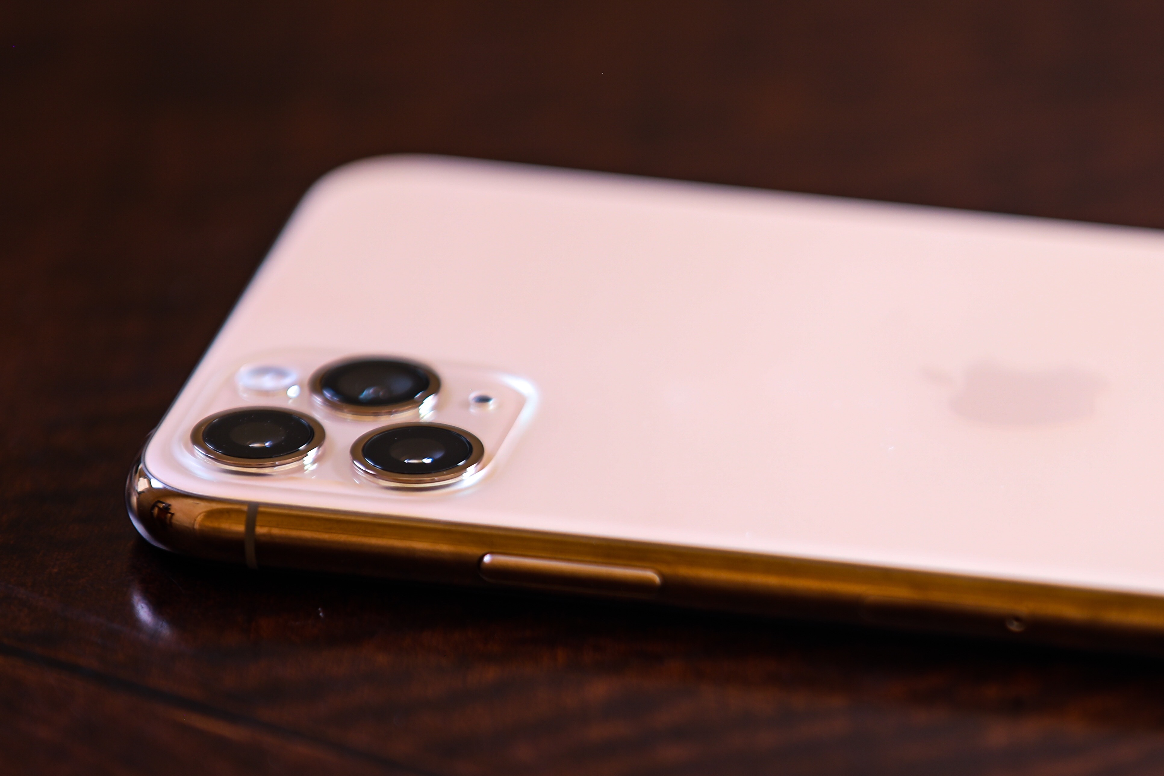 a photo of an Apple iPhone laying screen side down so the camera lenses are visible.