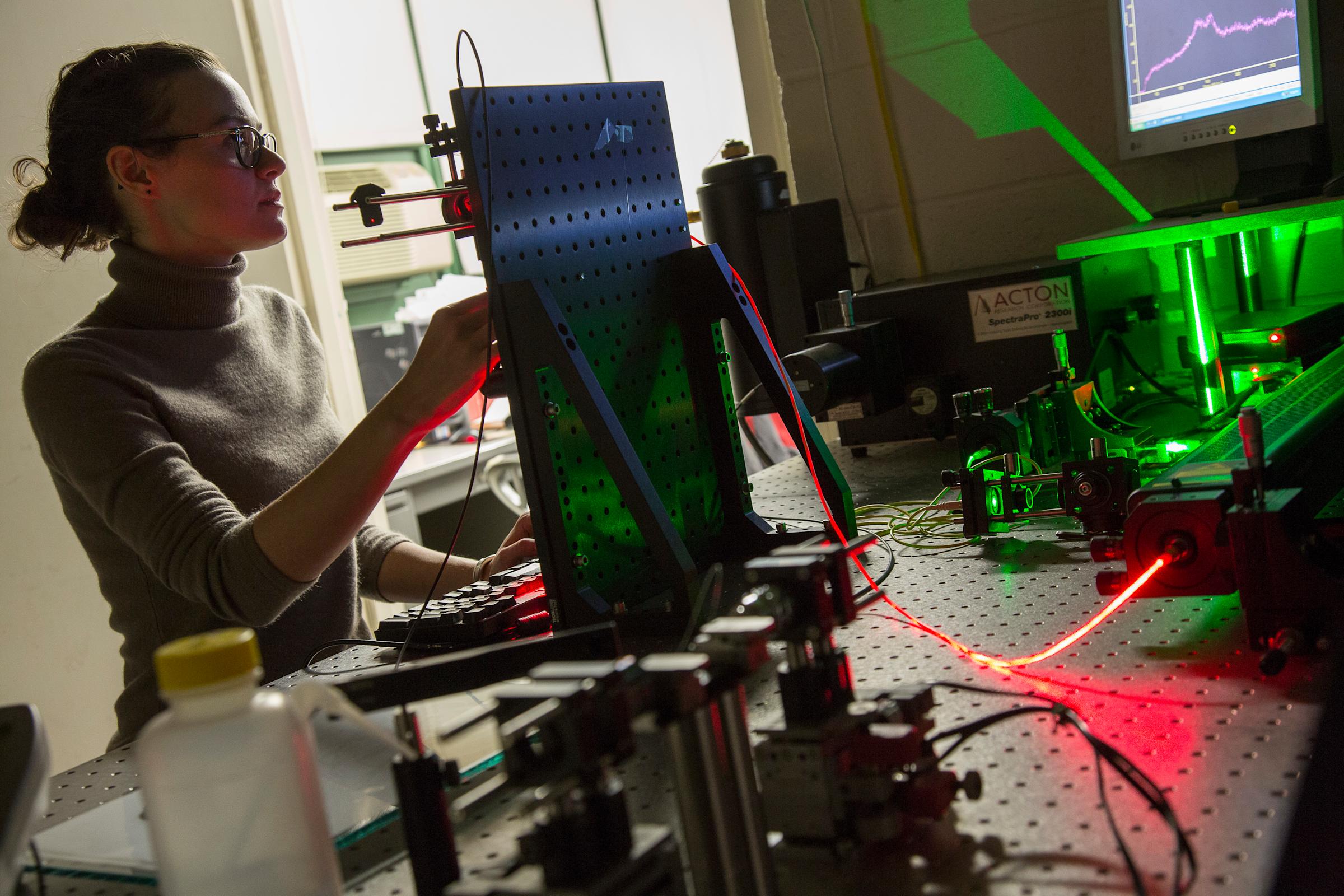 student in laser lab in the Department of Physics