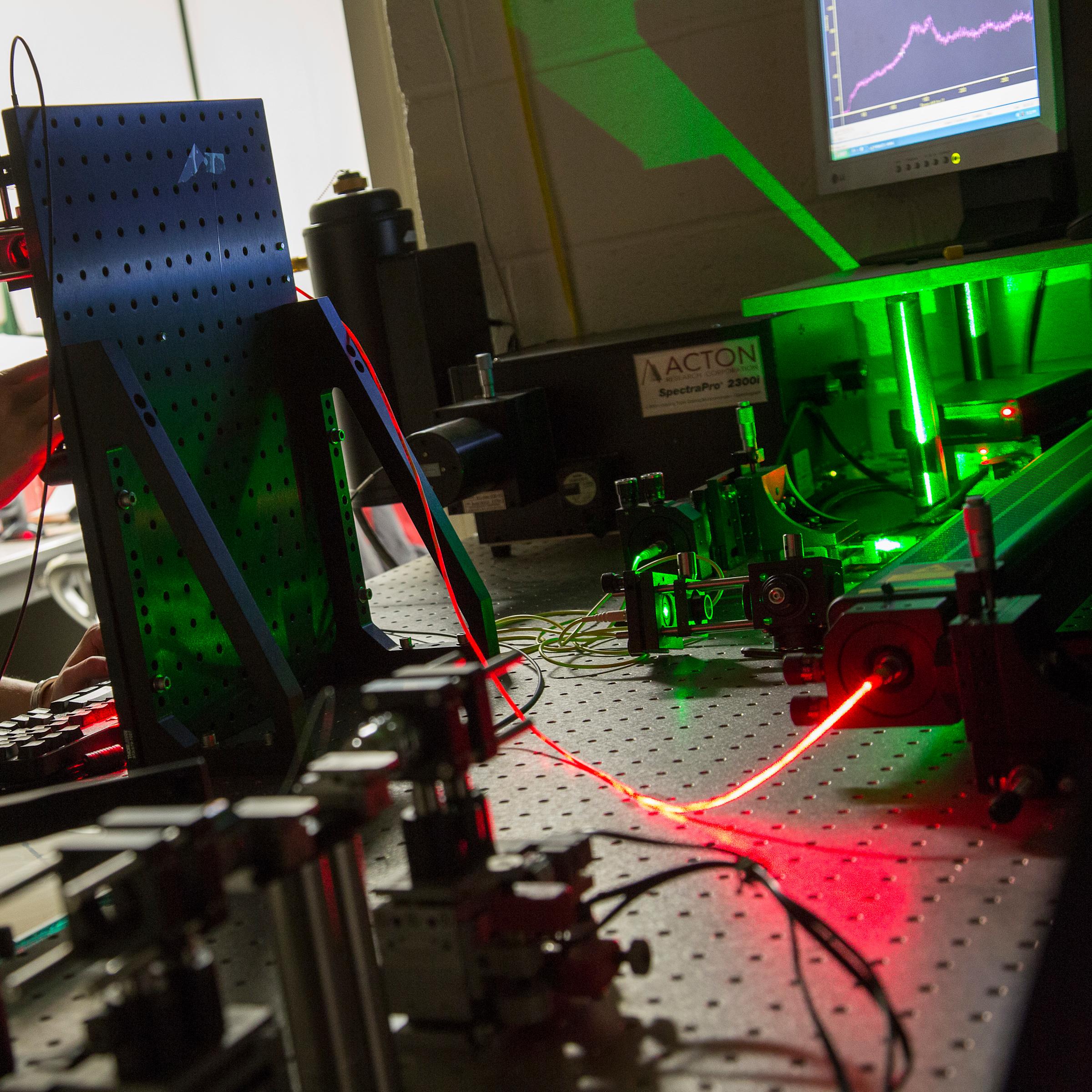 student in laser lab in the Department of Physics