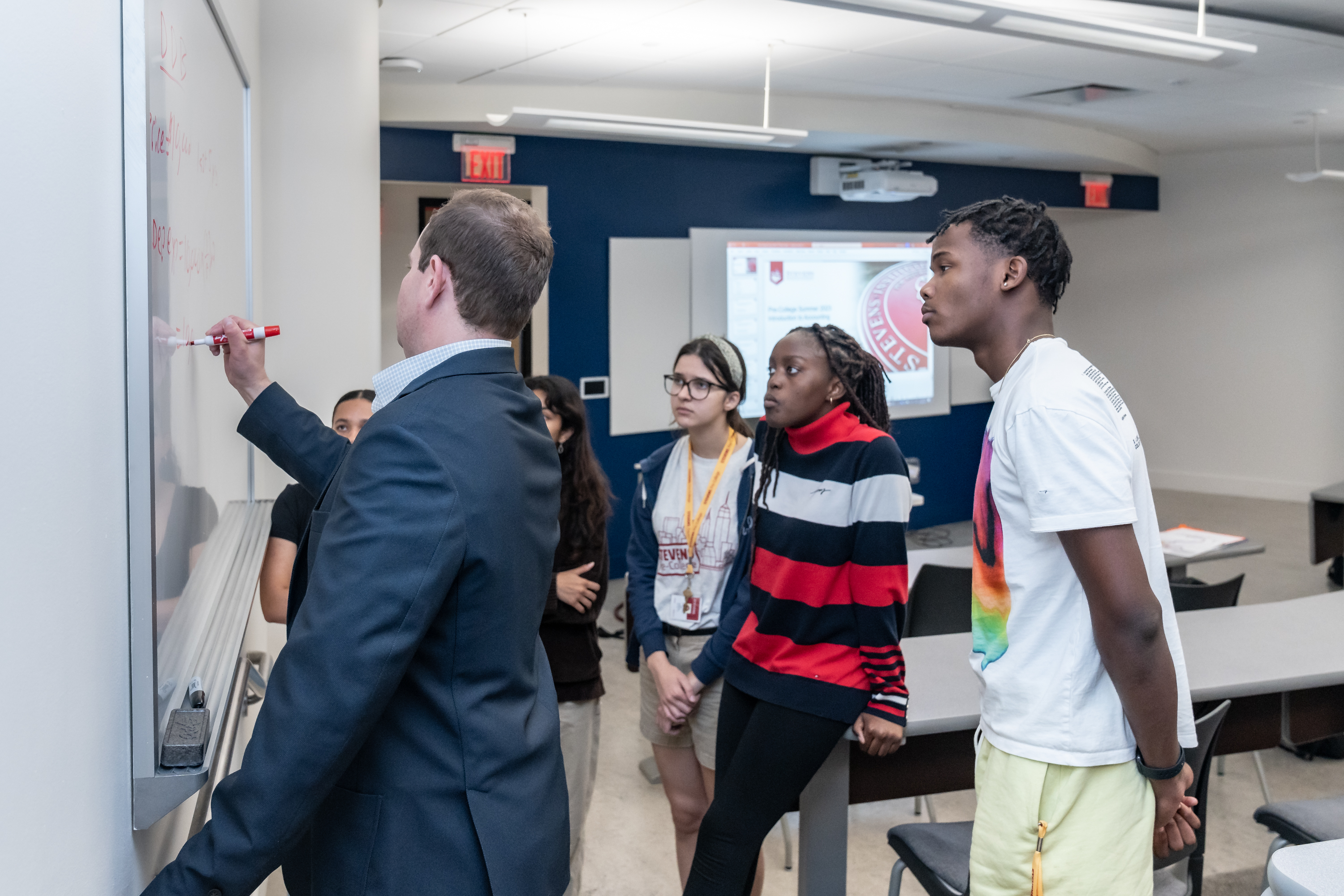 Professor teaching students in classroom