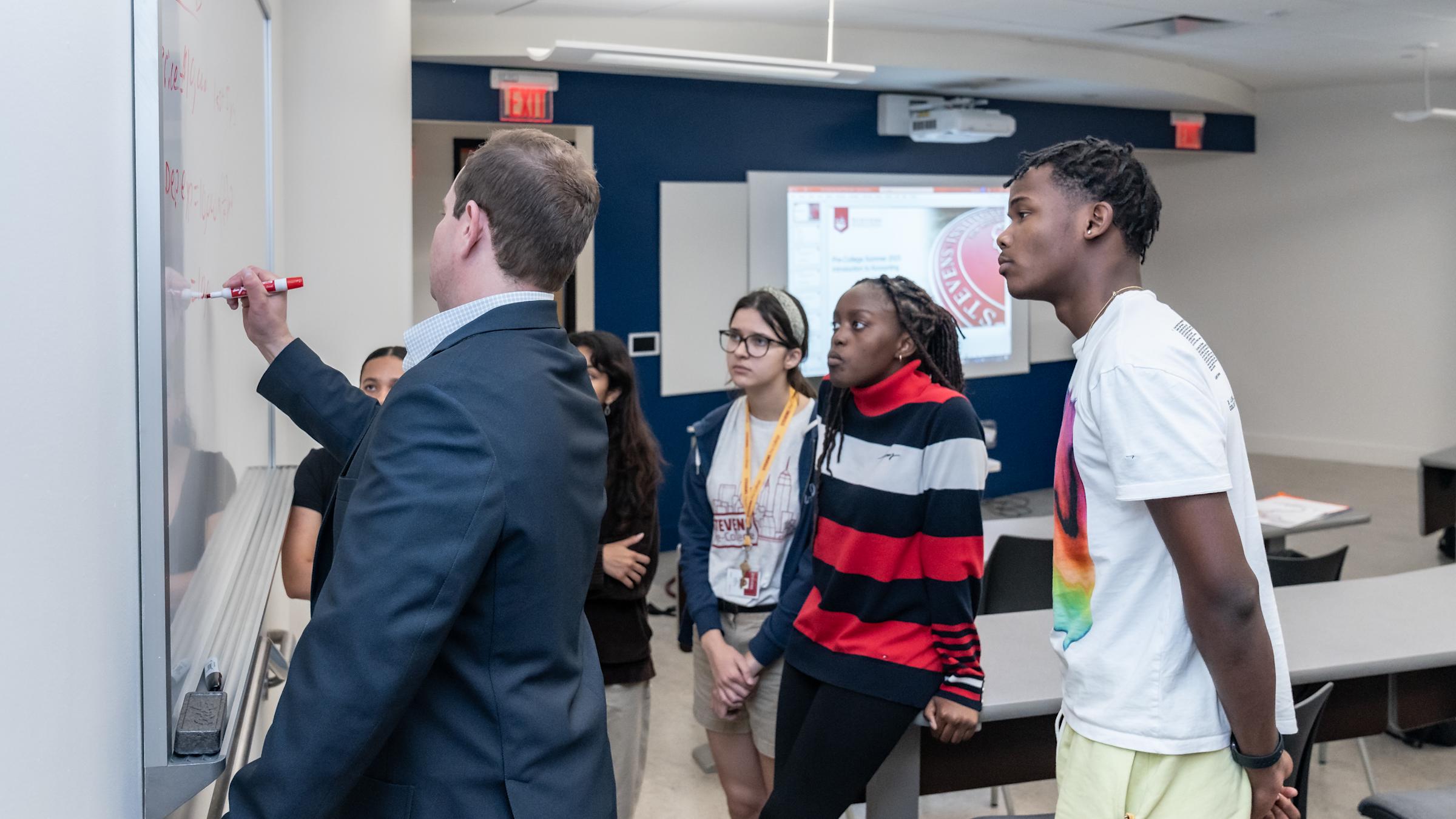 Professor teaching students in classroom