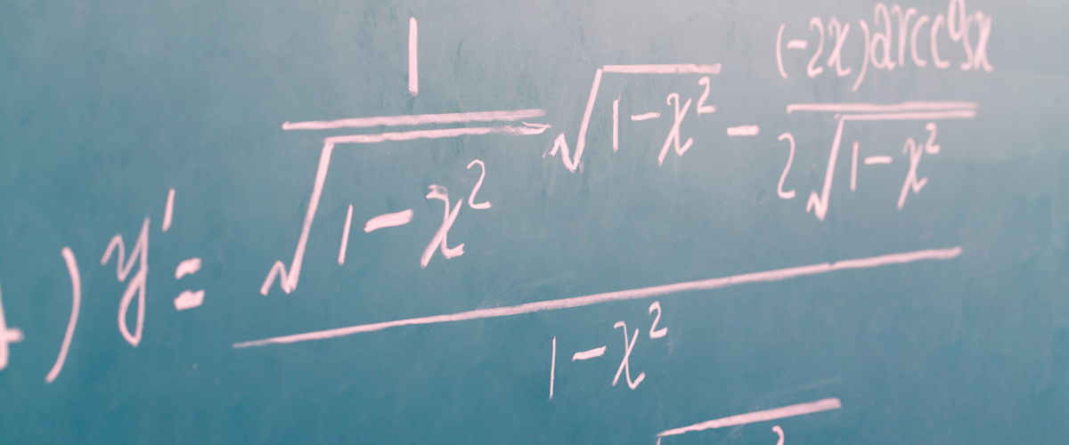 complex math equations written on a chalkboard