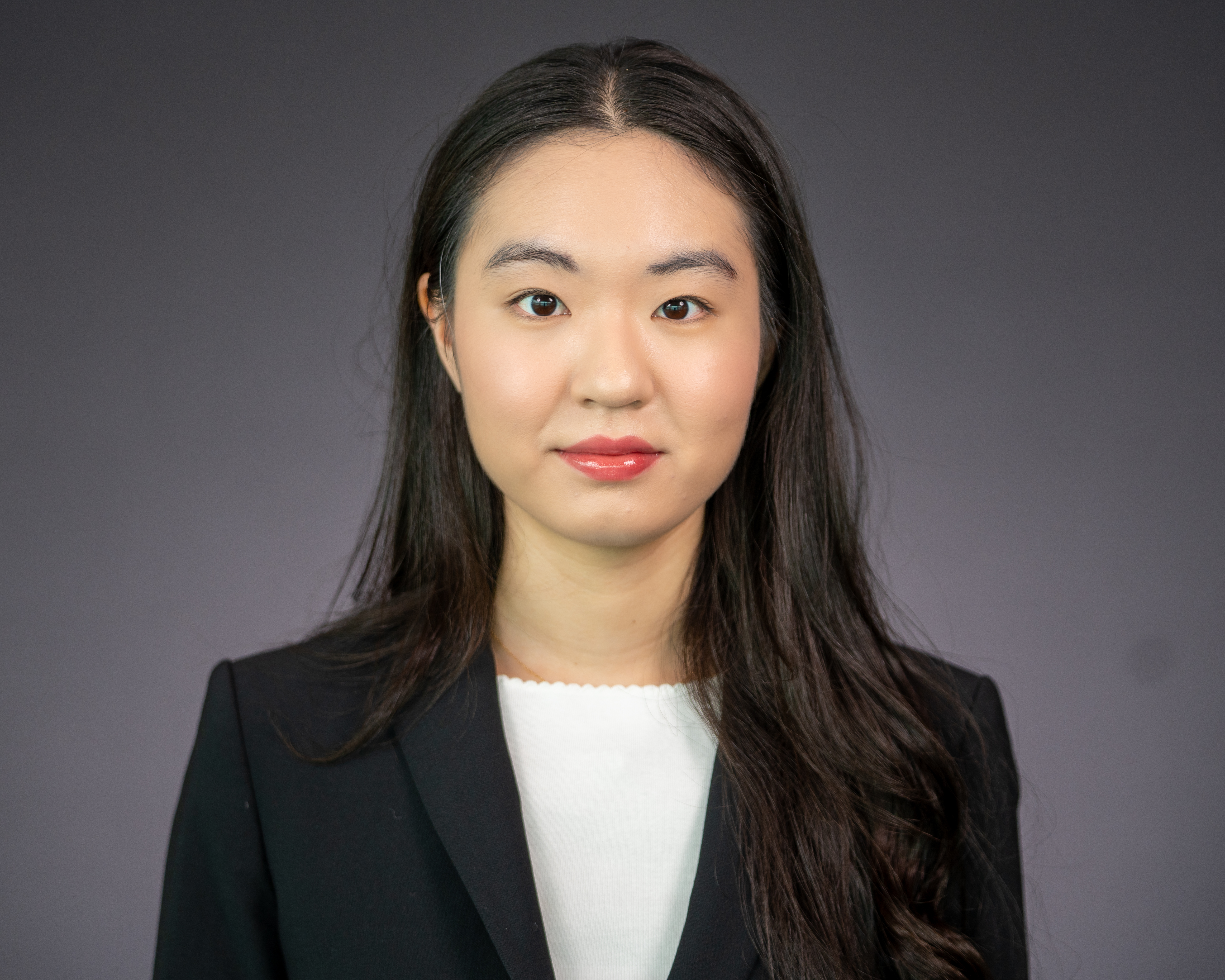 Headshot of Audrey Yoo wearing professional attire. 