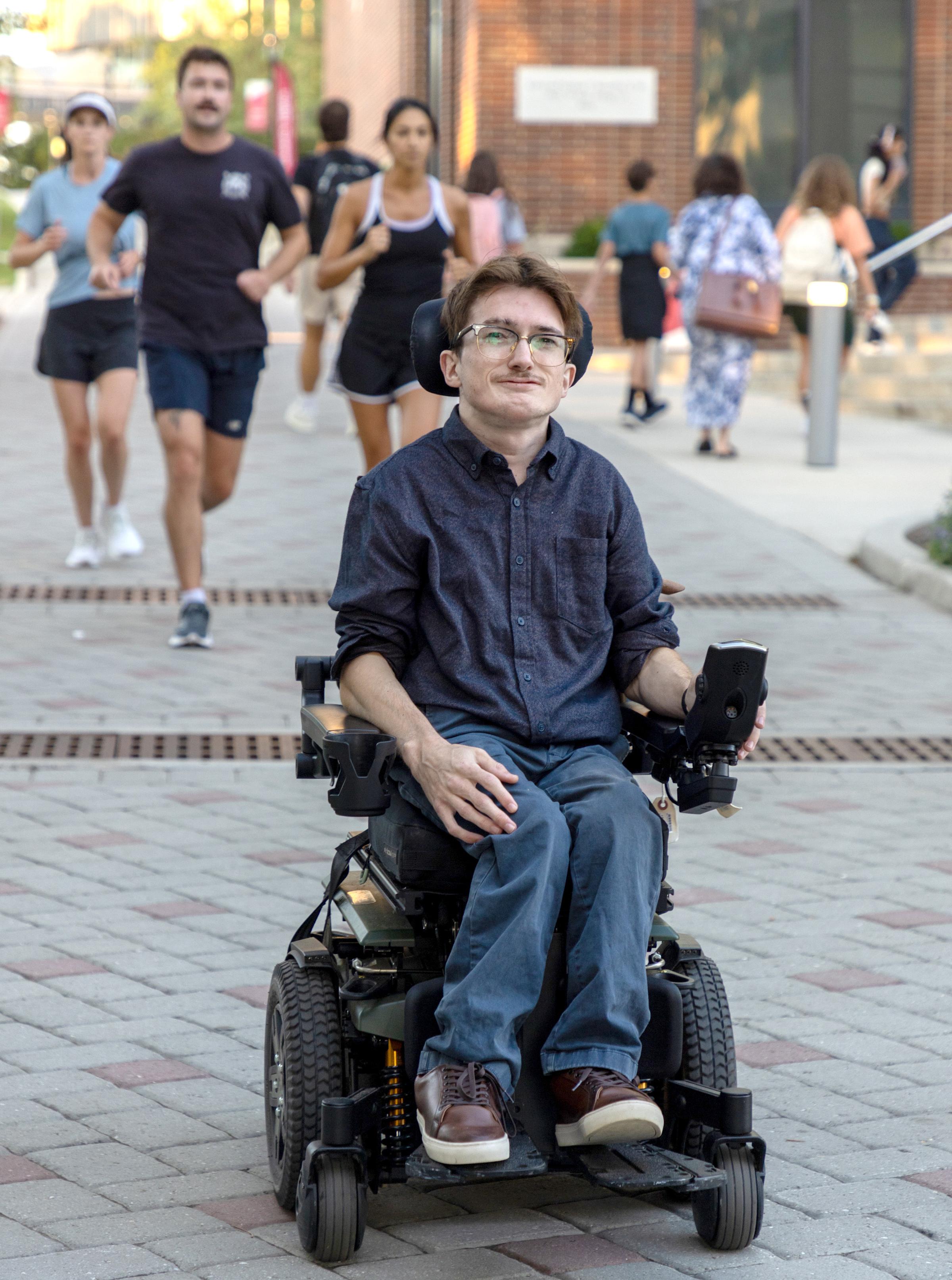 Jack Brummer glides his wheelchair down Wittpenn Walk.