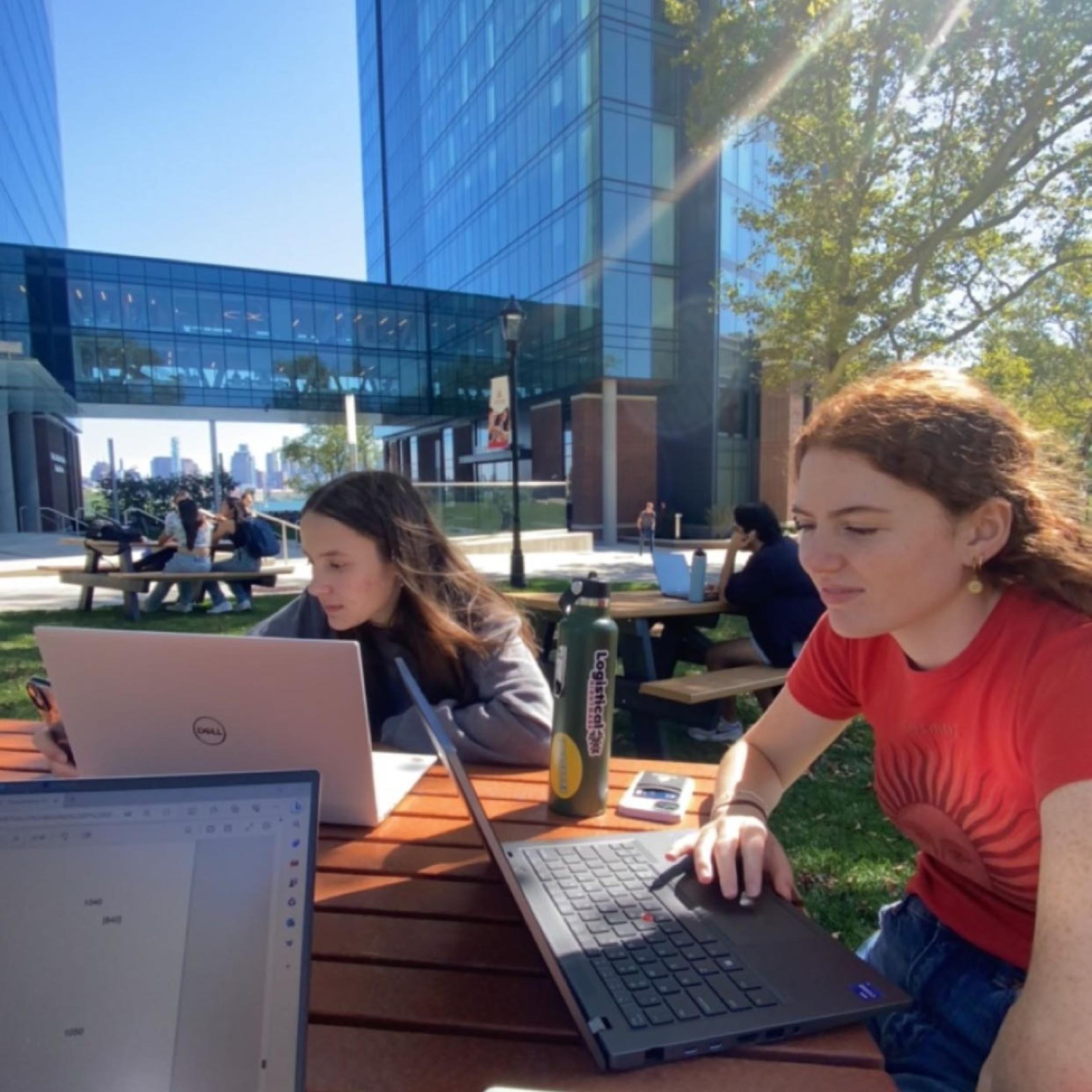 Students studying outside in front of the UCC