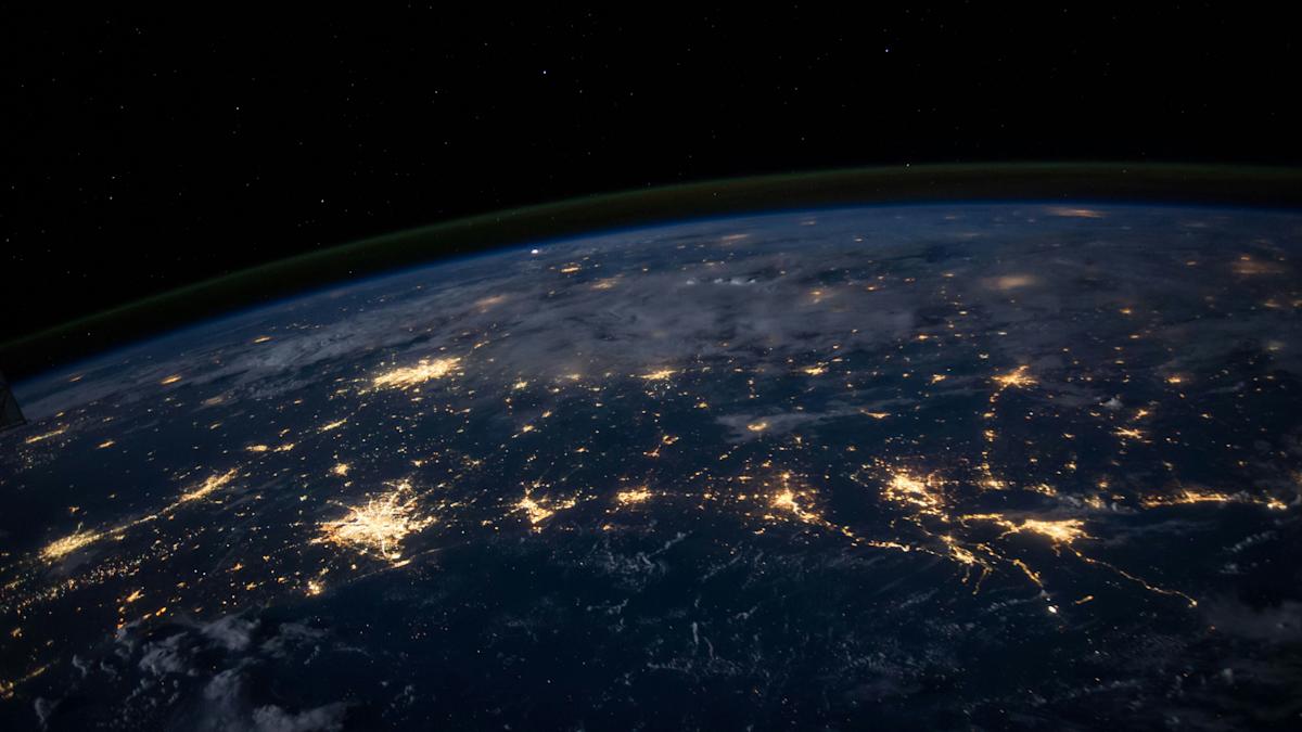 Rendering of a globe with a connective system grid of light.