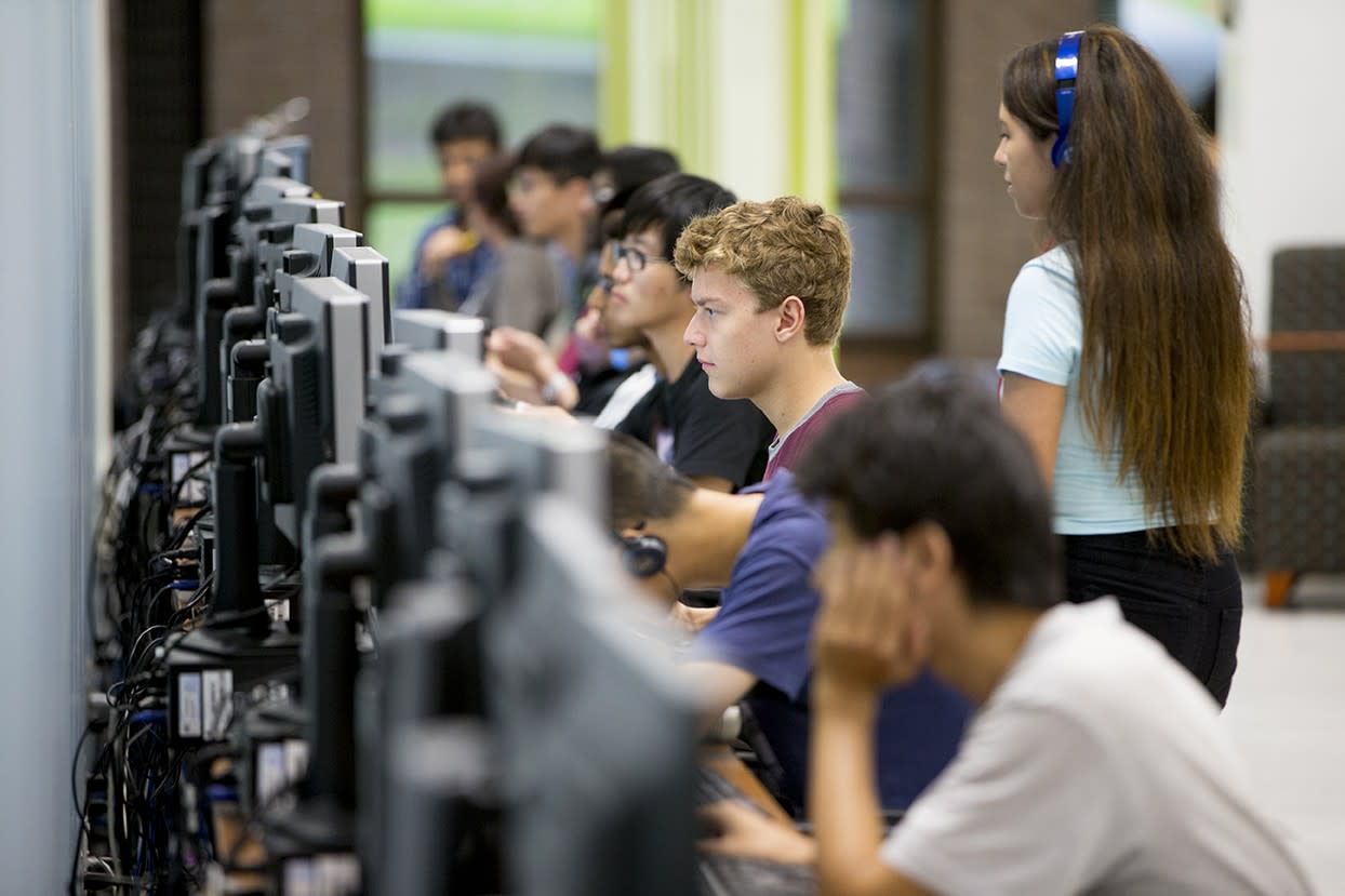 Students in classroom working on computers 