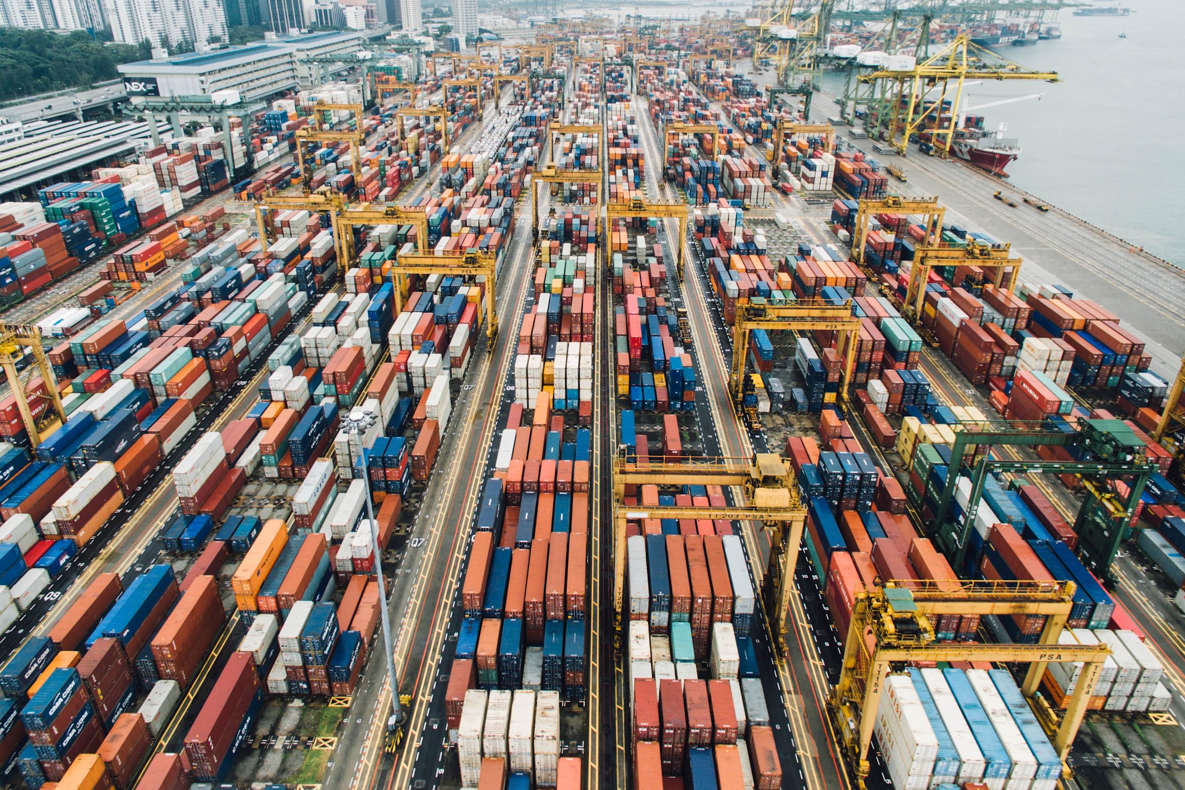 Cargo containers piled up at a port facility