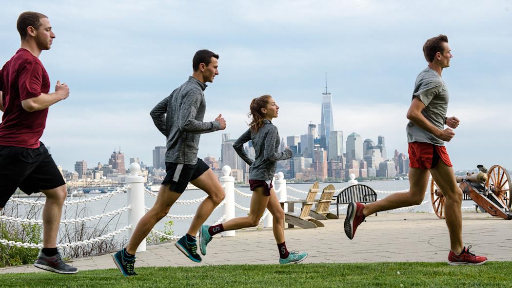 Students running on campus