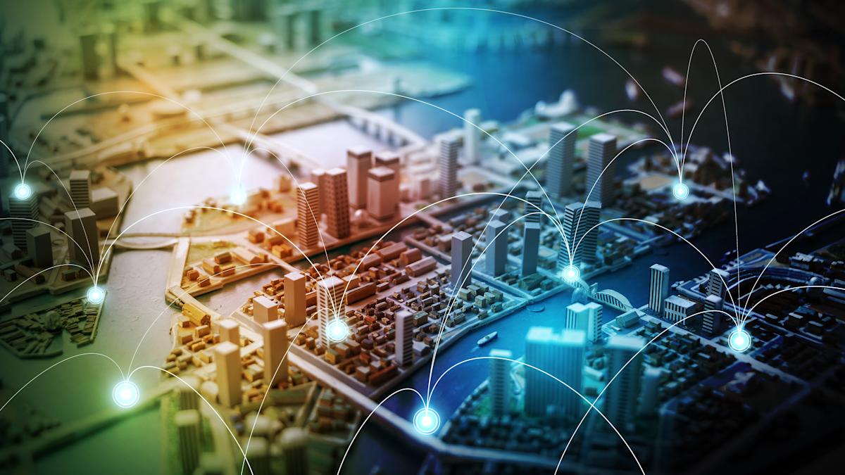 aerial view of city with interconnecting nodes.