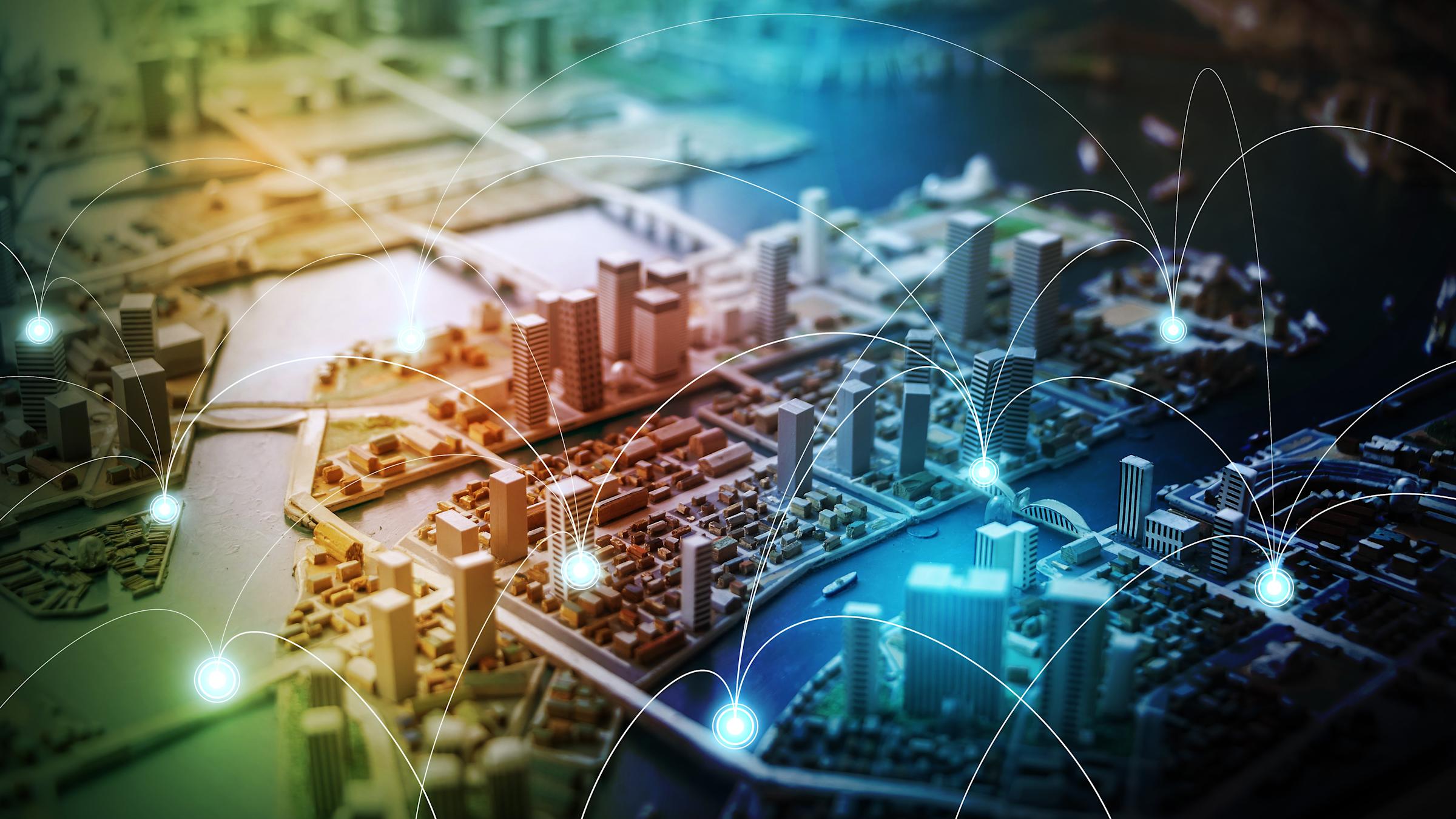 aerial view of city with interconnecting nodes.